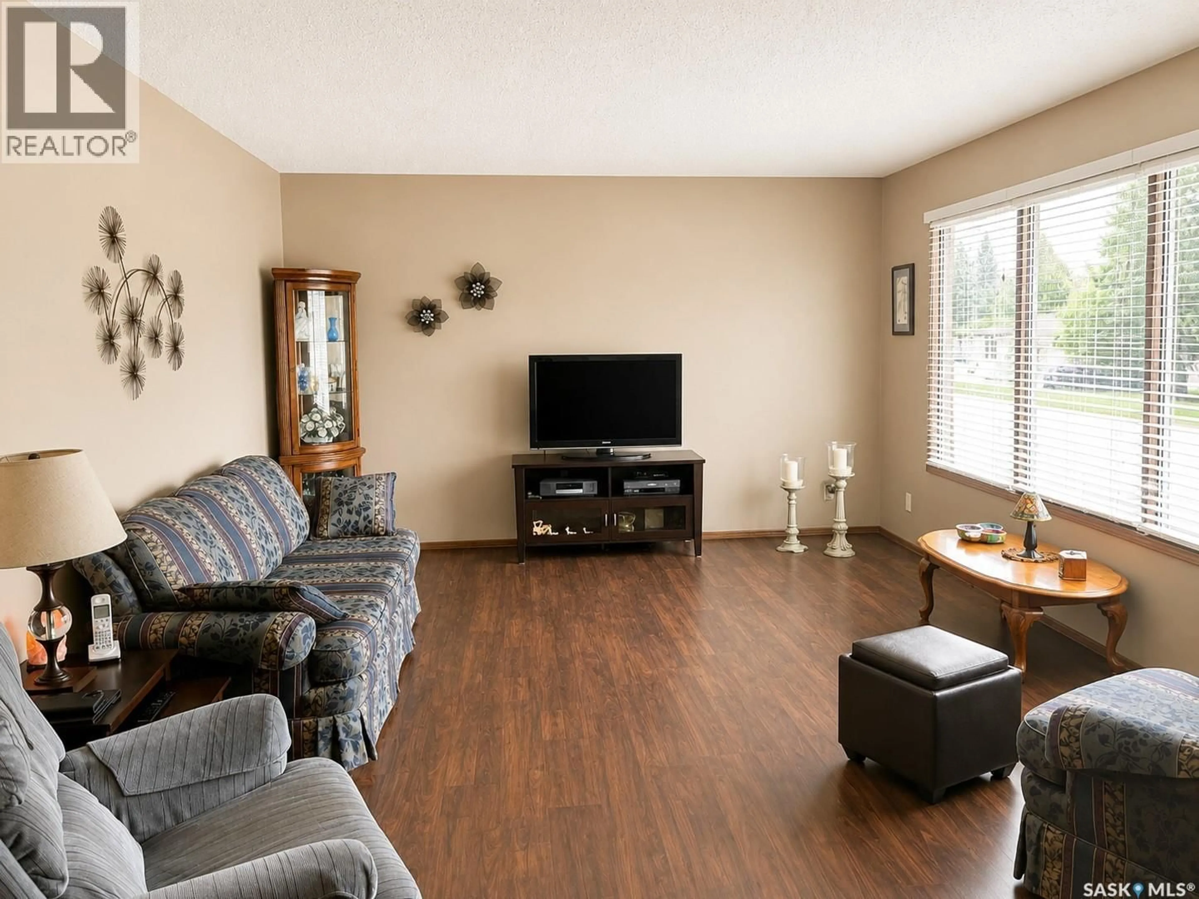 Living room with furniture, wood/laminate floor for 205 4TH AVENUE, Shellbrook Saskatchewan S0J2E0