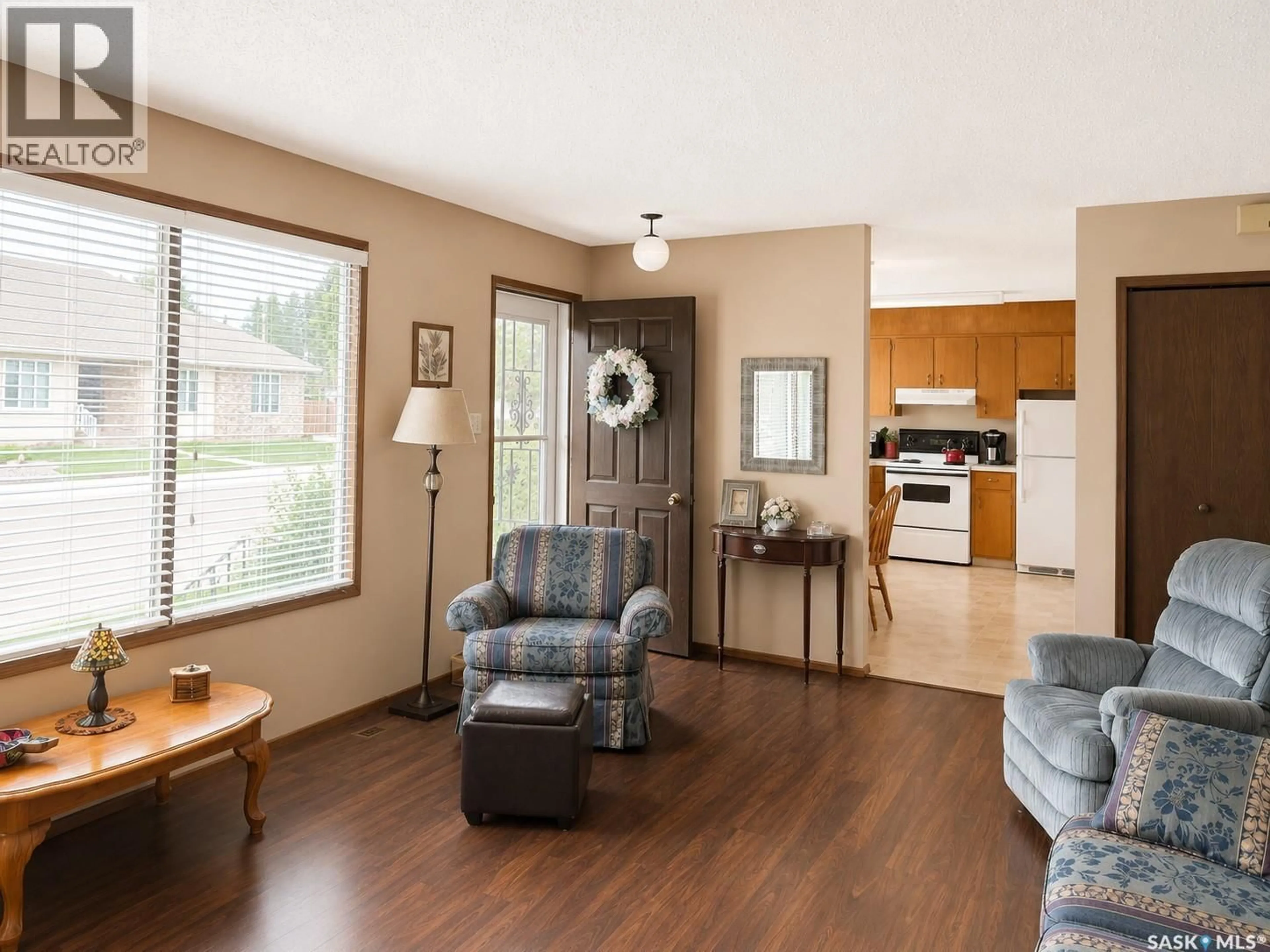 Living room with furniture, wood/laminate floor for 205 4TH AVENUE, Shellbrook Saskatchewan S0J2E0