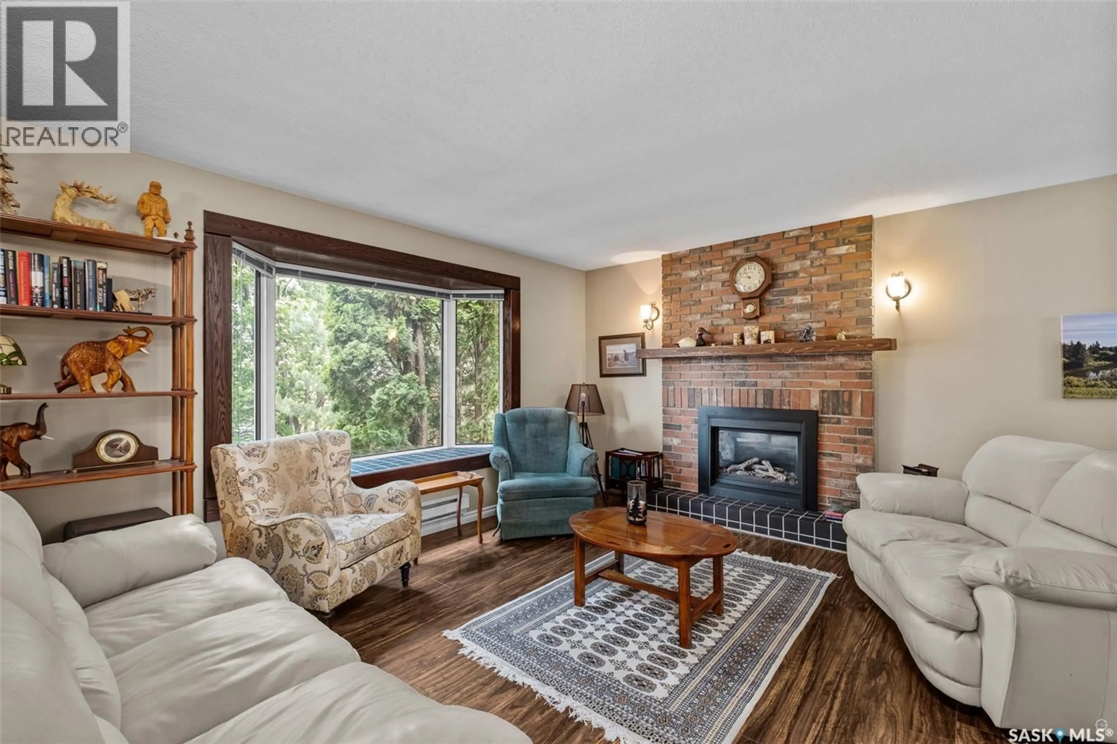 Living room with furniture, wood/laminate floor for 2834 DUNN DRIVE, Prince Albert Saskatchewan S6V6K7