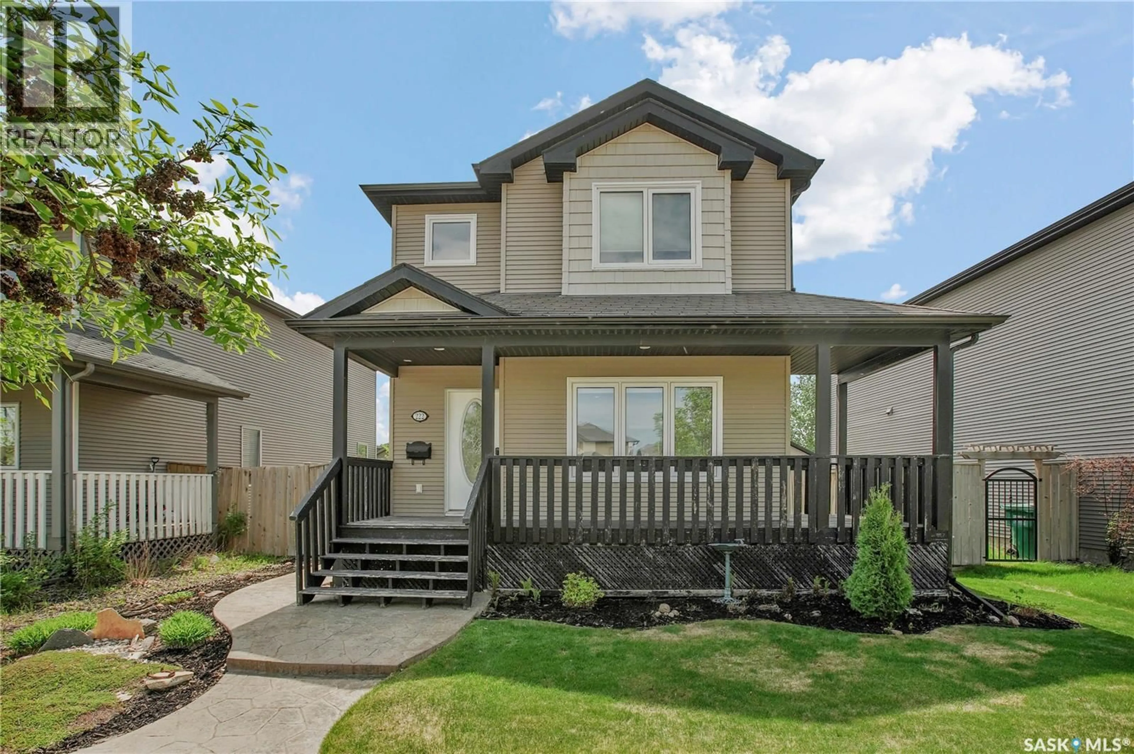 Home with vinyl exterior material, street for 222 WILLOWGROVE BOULEVARD, Saskatoon Saskatchewan S7W1A2