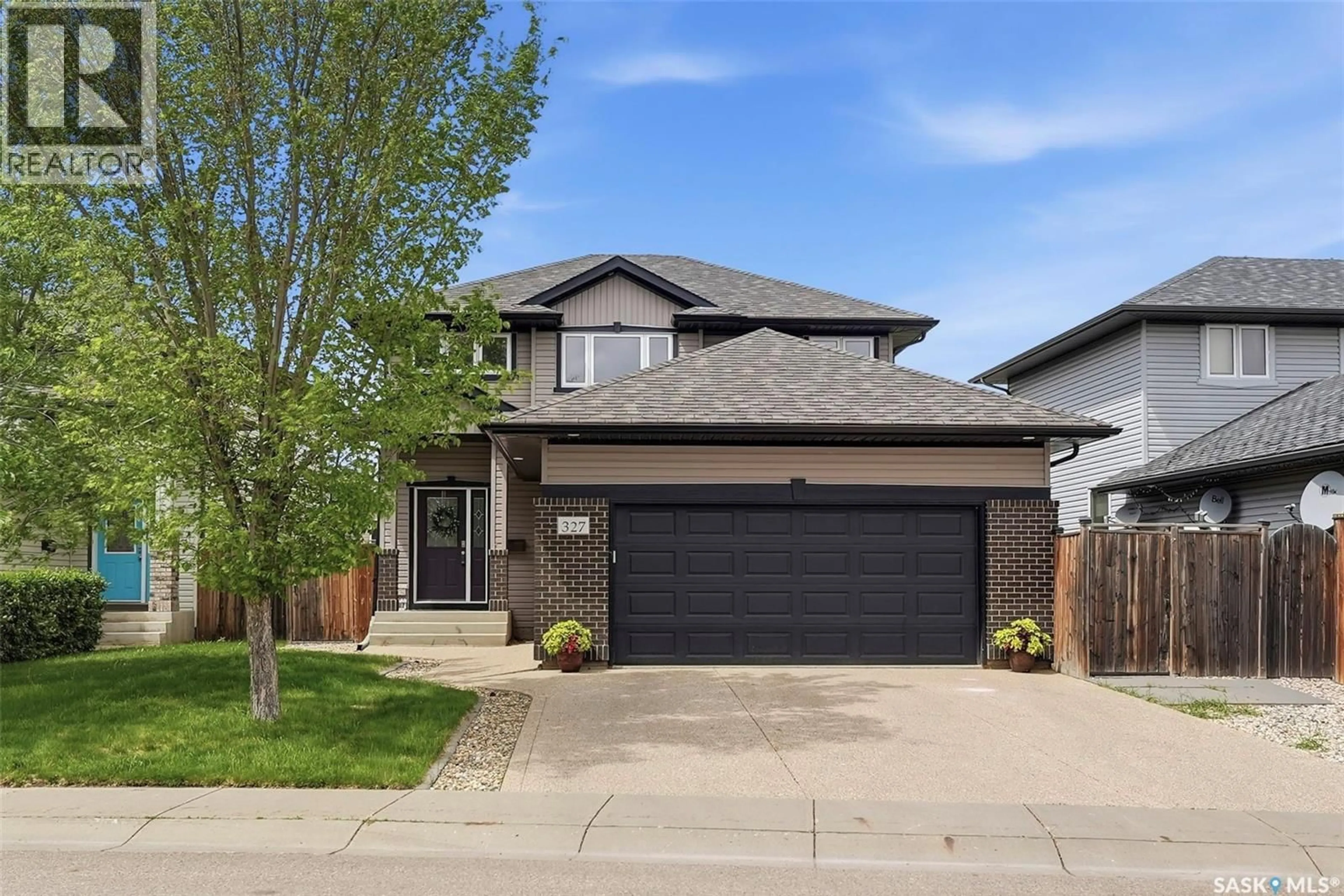 Home with brick exterior material, street for 327 HETTLE COVE, Saskatoon Saskatchewan S7T0E8