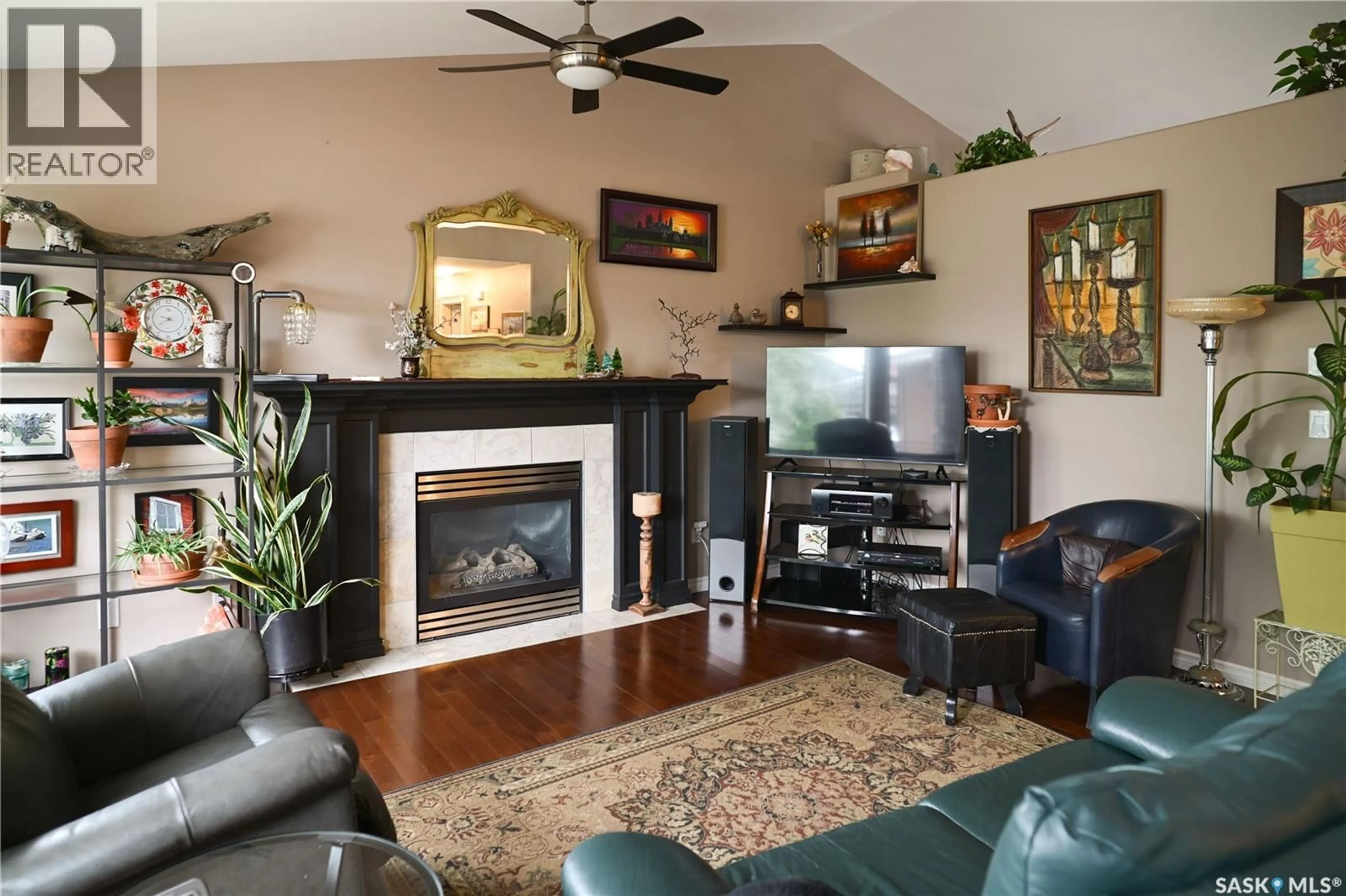 Living room with furniture, wood/laminate floor for 319 STEFANIUK CRESCENT, Saskatoon Saskatchewan S7H0H6