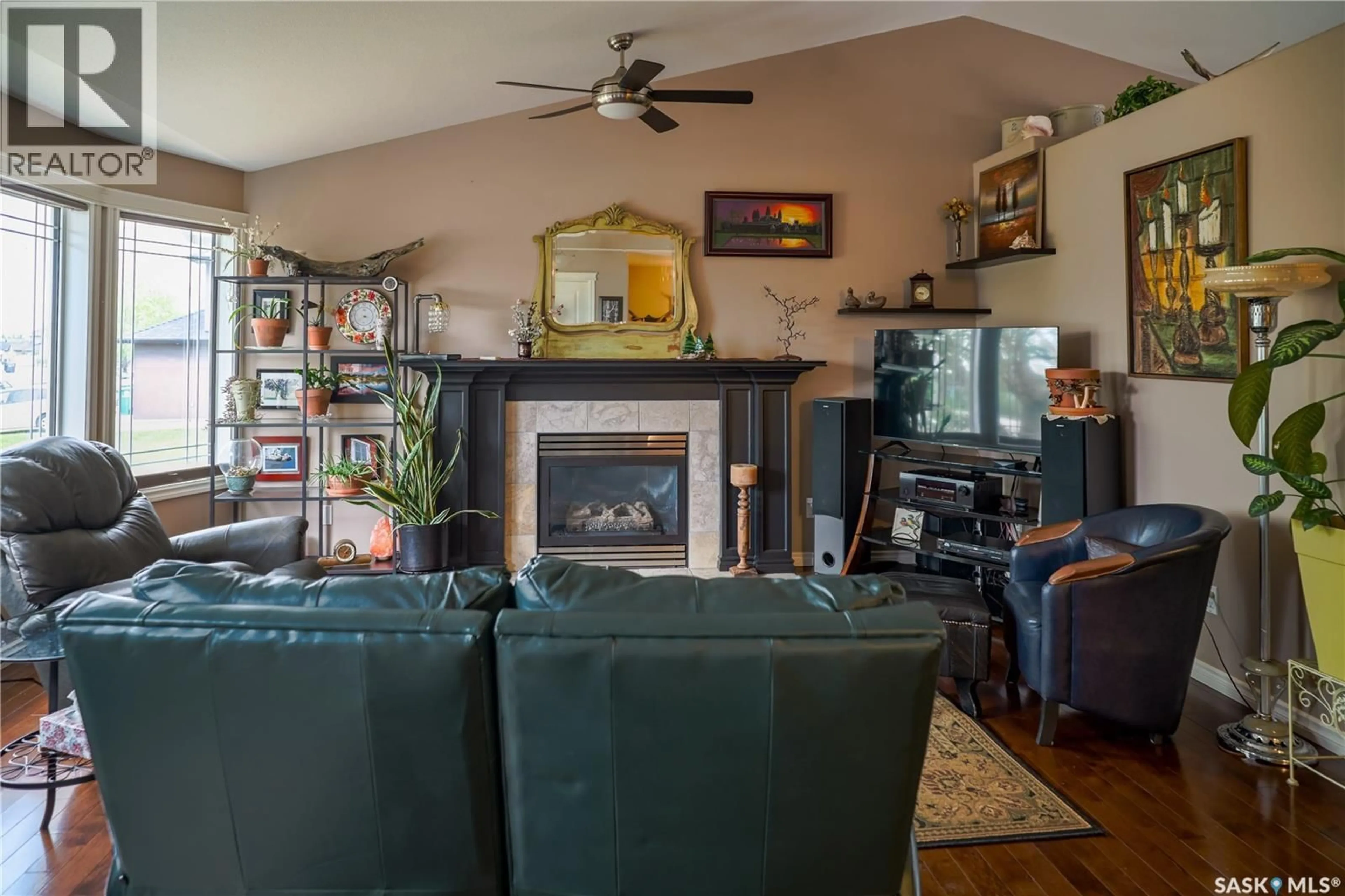 Living room with furniture, wood/laminate floor for 319 STEFANIUK CRESCENT, Saskatoon Saskatchewan S7H0H6