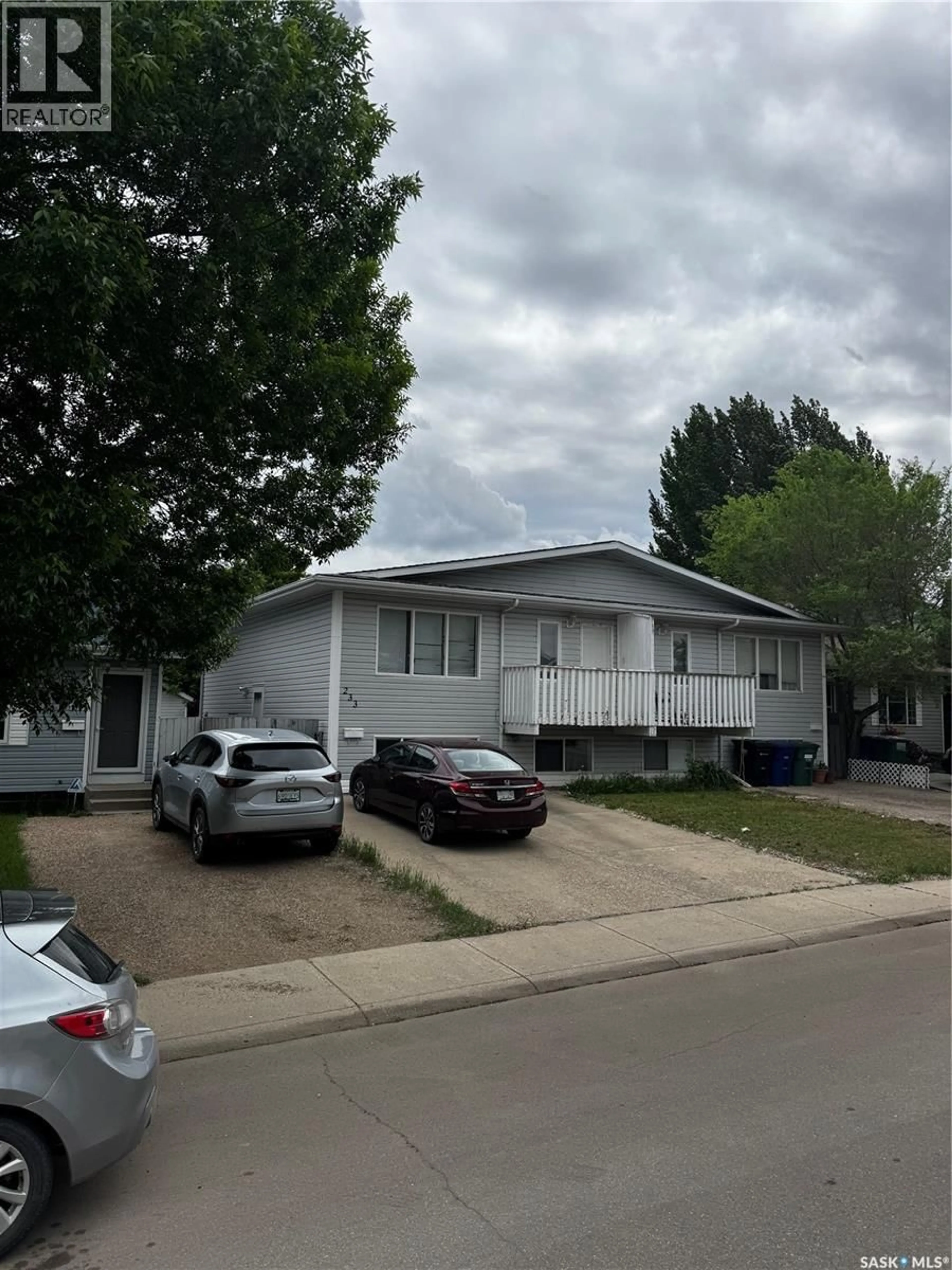 Home with vinyl exterior material, street for 233 LOCHRIE CRESCENT, Saskatoon Saskatchewan S7M5E3