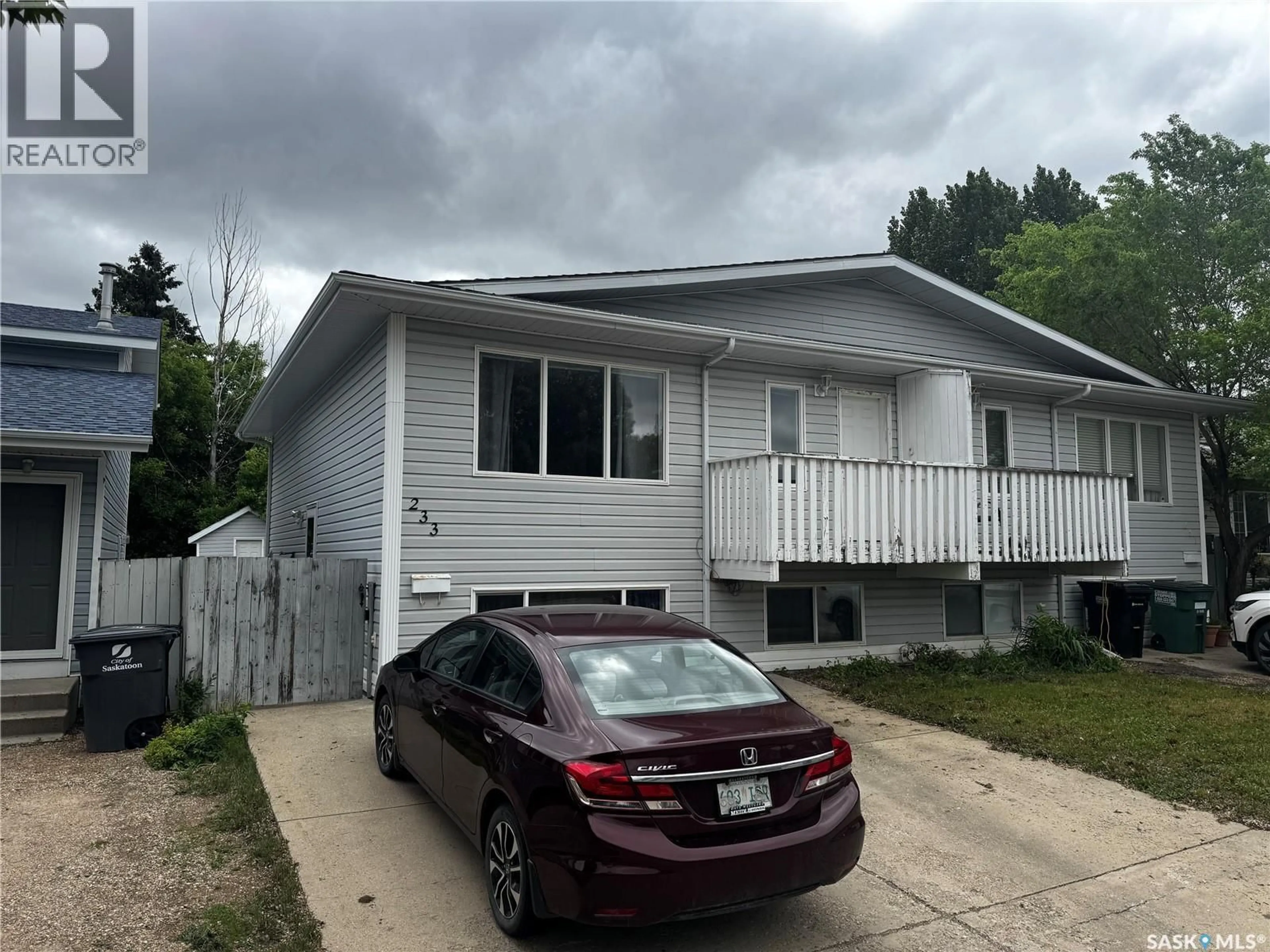 Home with vinyl exterior material, street for 233 LOCHRIE CRESCENT, Saskatoon Saskatchewan S7M5E3
