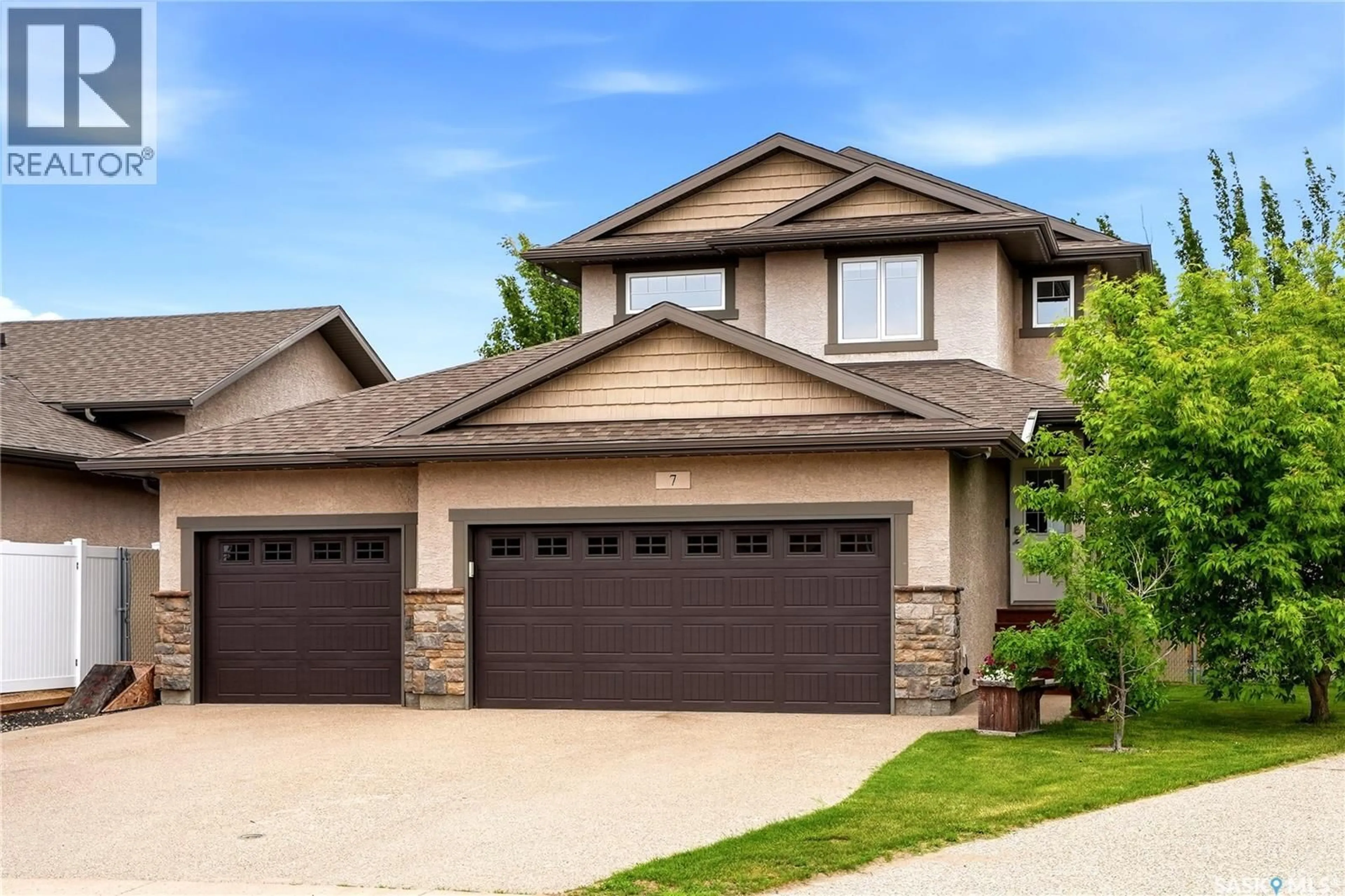 Home with vinyl exterior material, street for 7 PLAINS ROAD, Pilot Butte Saskatchewan S0G3Z0