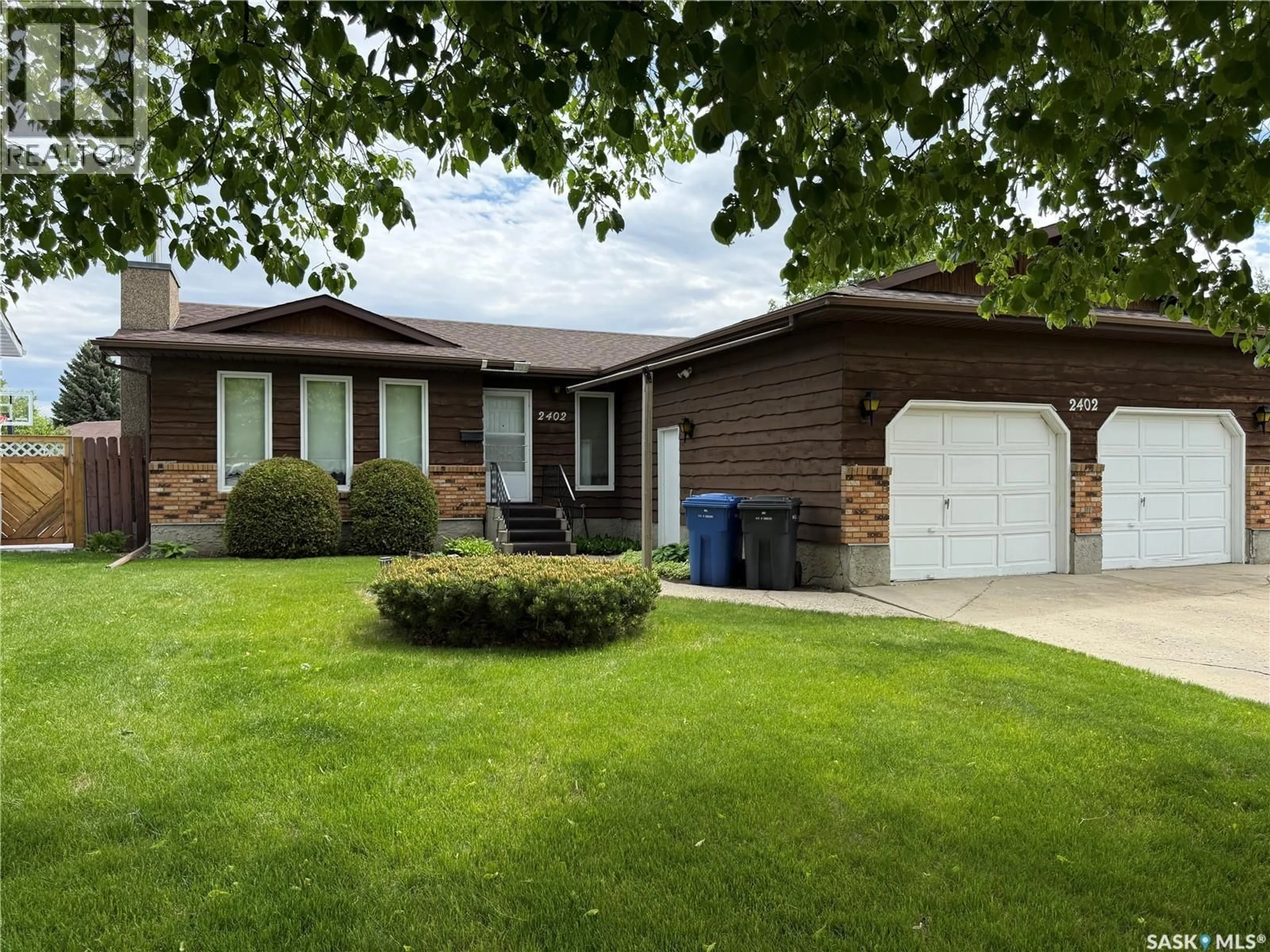Home with vinyl exterior material, street for 2402 CANARY STREET, North Battleford Saskatchewan S9A3T9