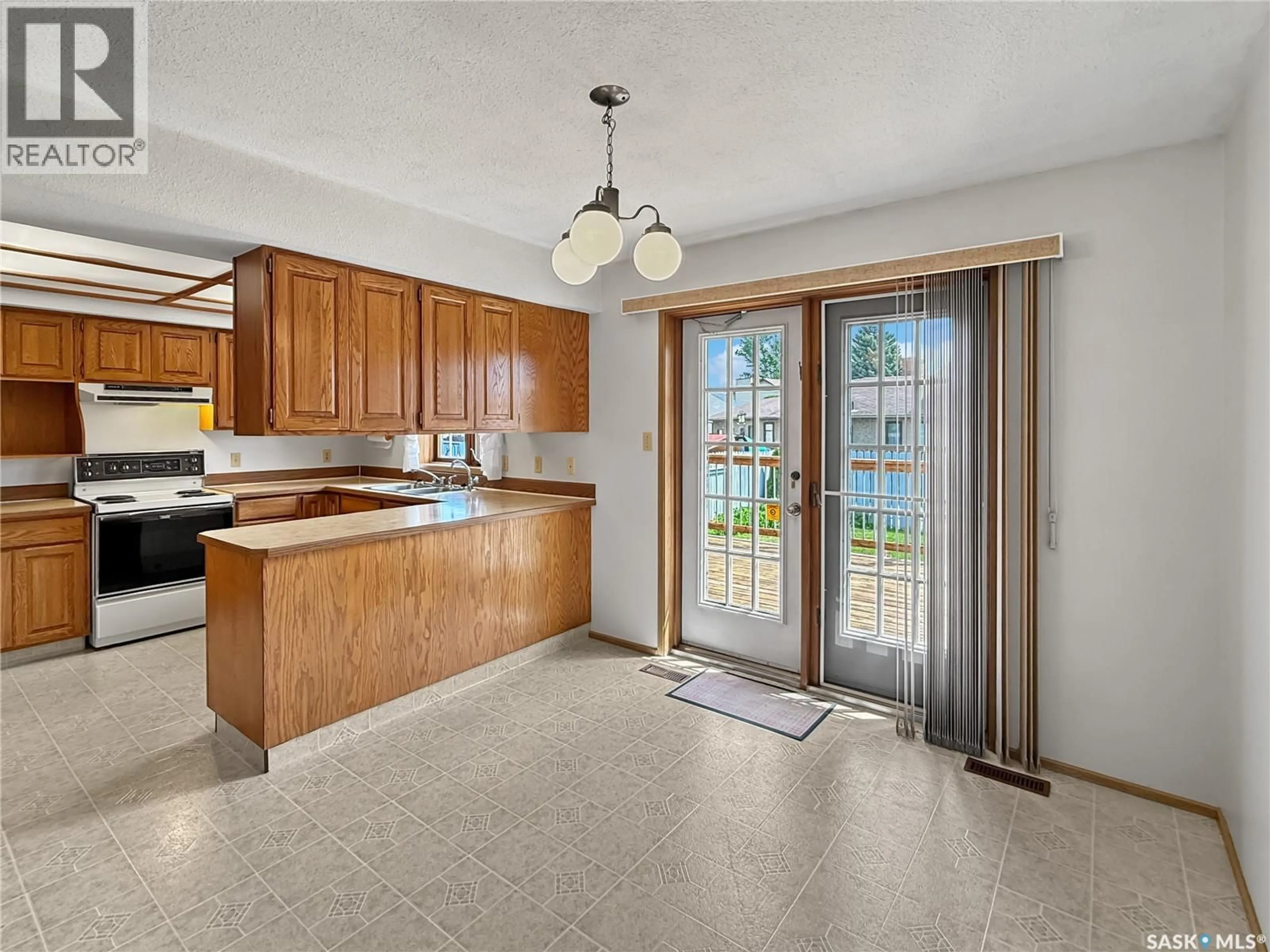 Open concept kitchen, ceramic/tile floor for 2402 CANARY STREET, North Battleford Saskatchewan S9A3T9
