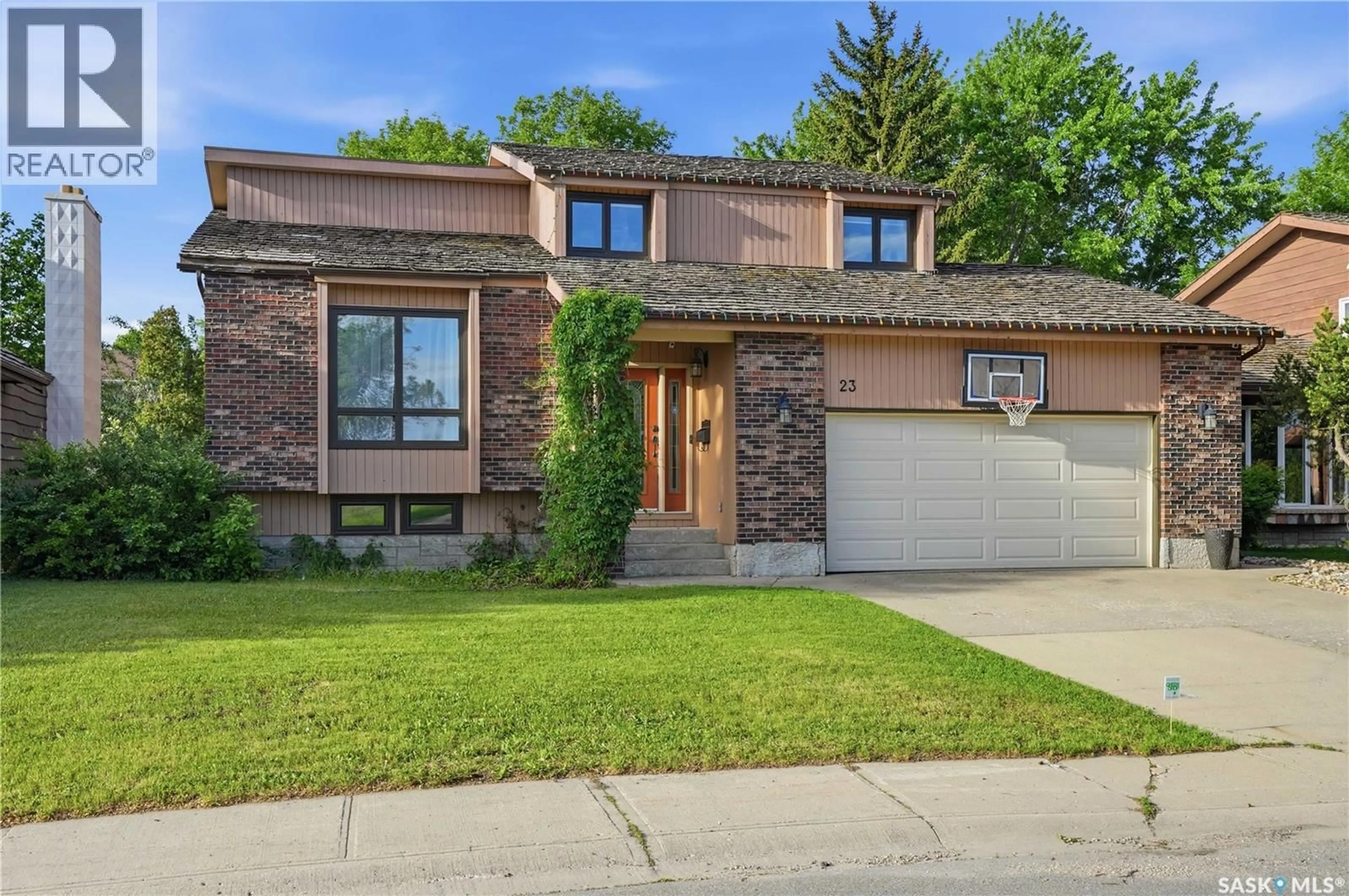 Home with brick exterior material, street for 23 COWIE ROAD, Regina Saskatchewan S4S6S2