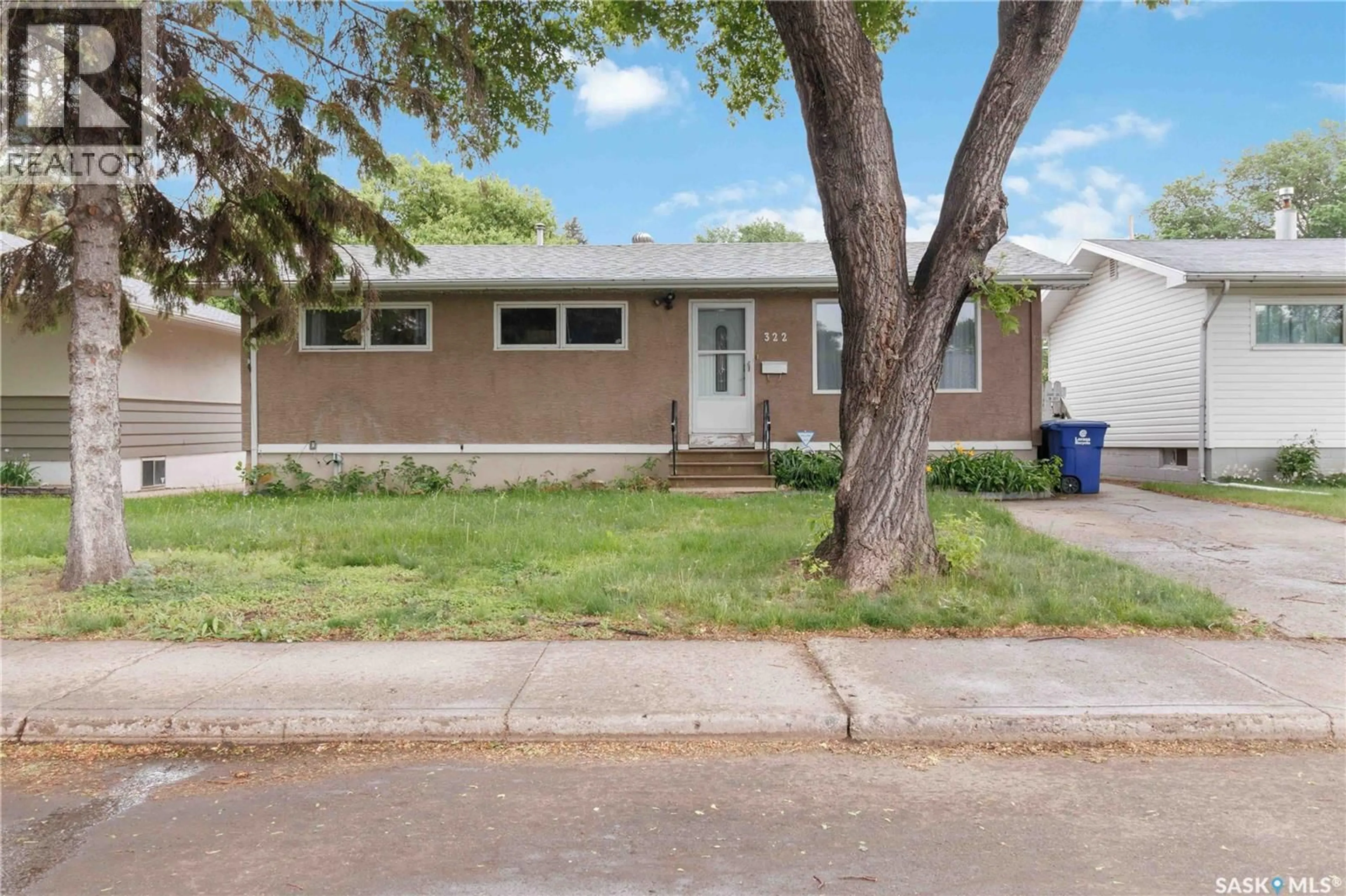 Home with vinyl exterior material, street for 322 U AVENUE, Saskatoon Saskatchewan S7L3C7
