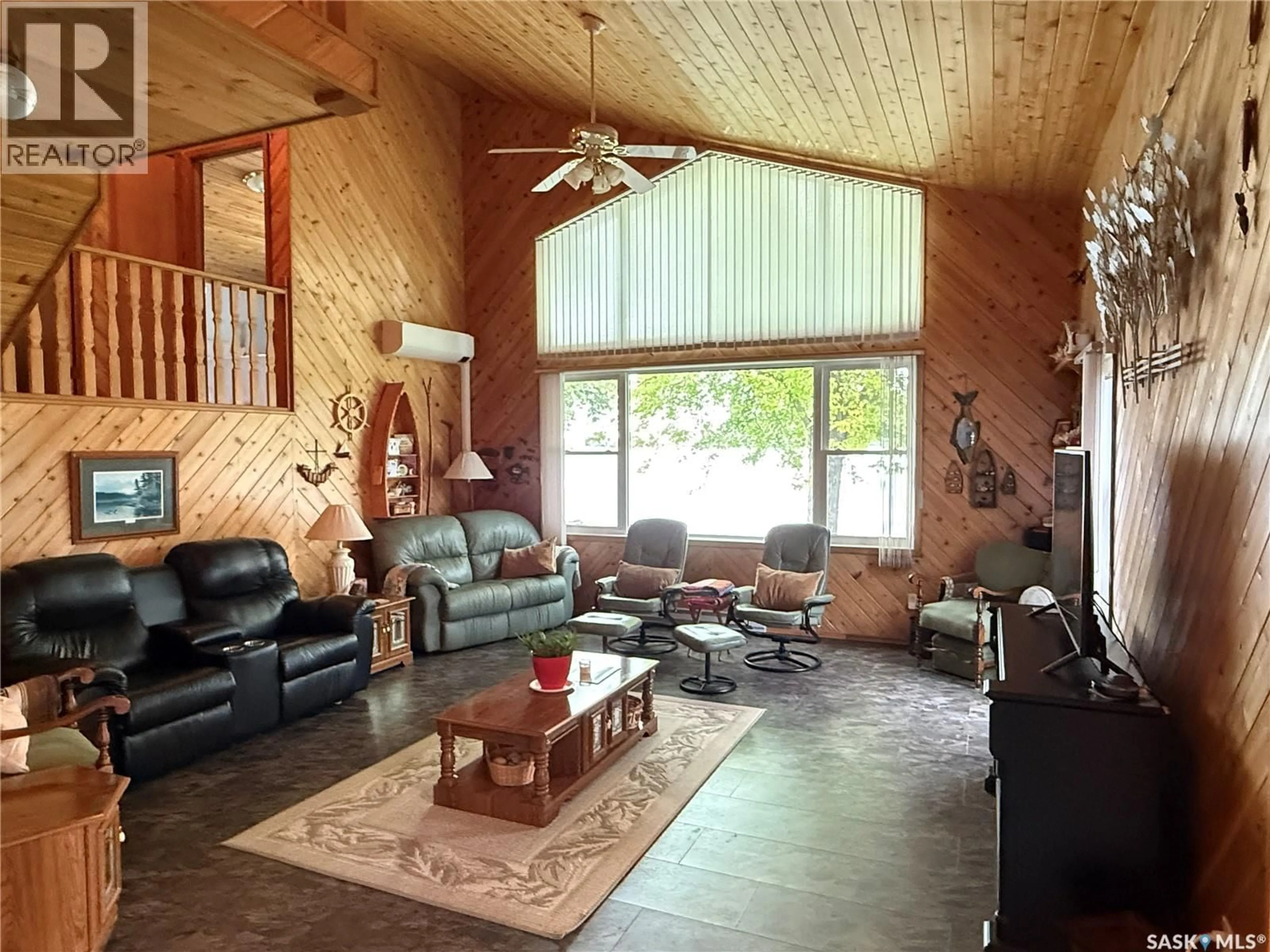Living room with furniture, wood/laminate floor for 10/12 - 10/12 LAKEVIEW LANE, Melville Beach Saskatchewan S0A1E0