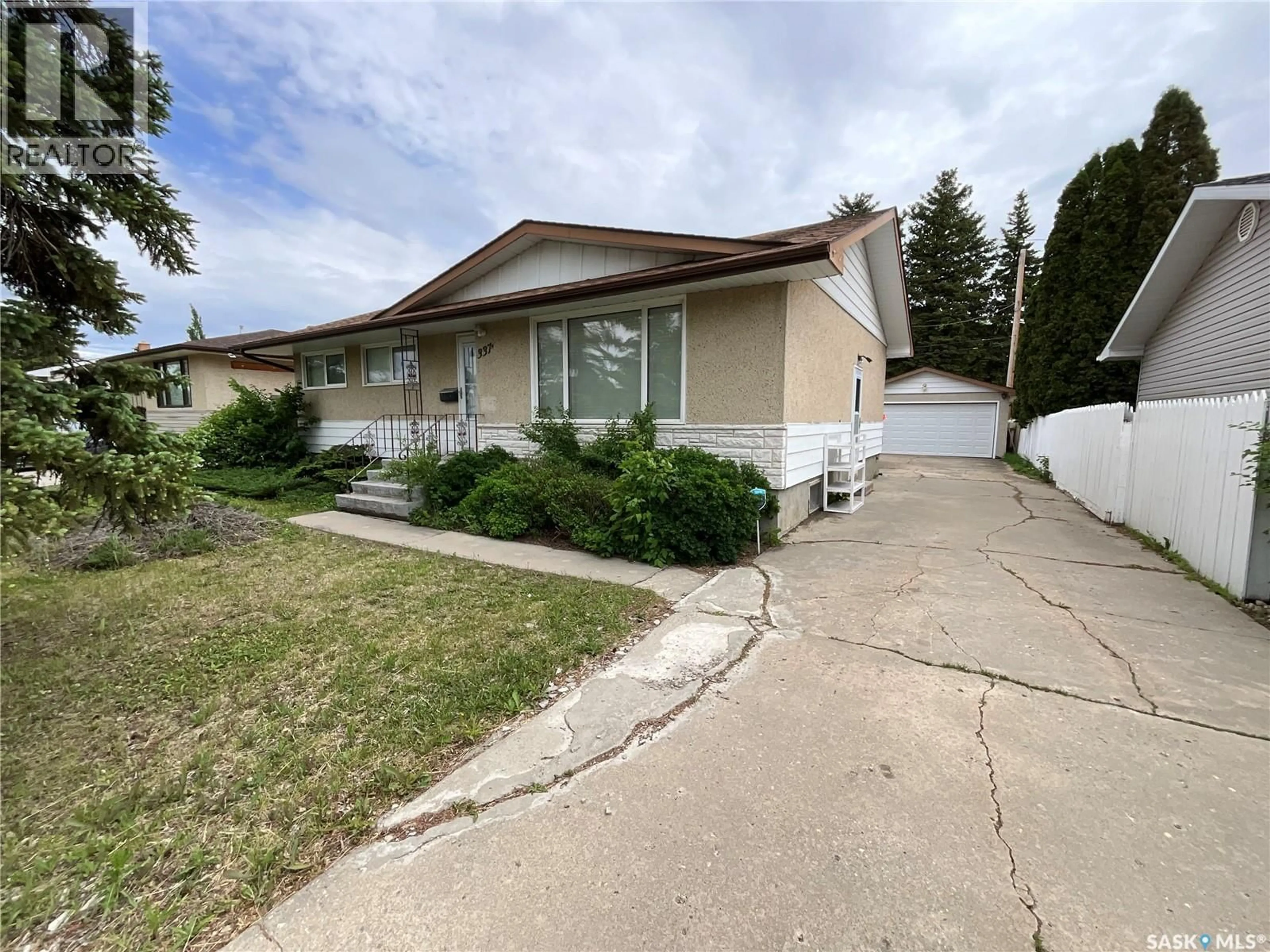 Home with vinyl exterior material, street for 337 MCINTOSH STREET, Regina Saskatchewan S4R5A1