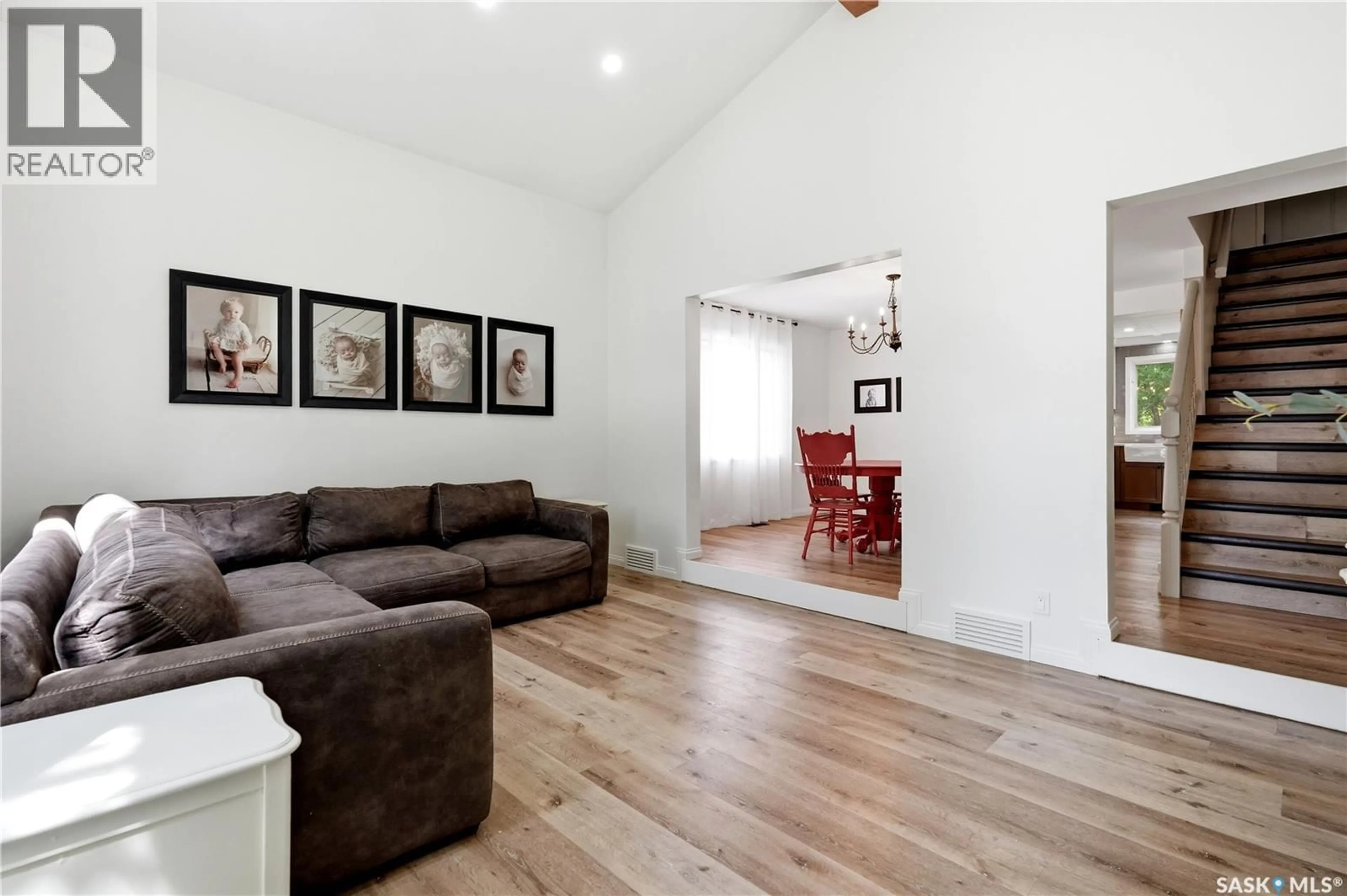 Living room with furniture, wood/laminate floor for 2206 HANOVER CRESCENT, Regina Saskatchewan S4V0Z6