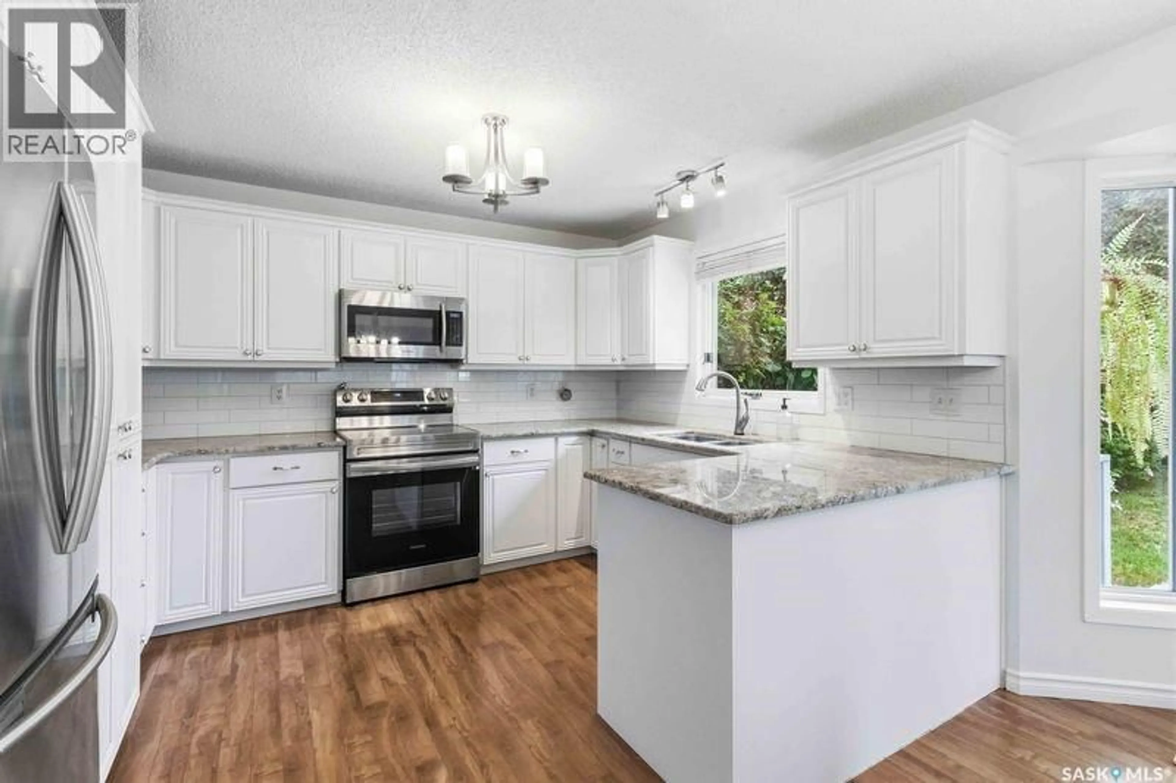 Open concept kitchen, ceramic/tile floor for 142 NEUSCH CRESCENT, Saskatoon Saskatchewan S7K7V3