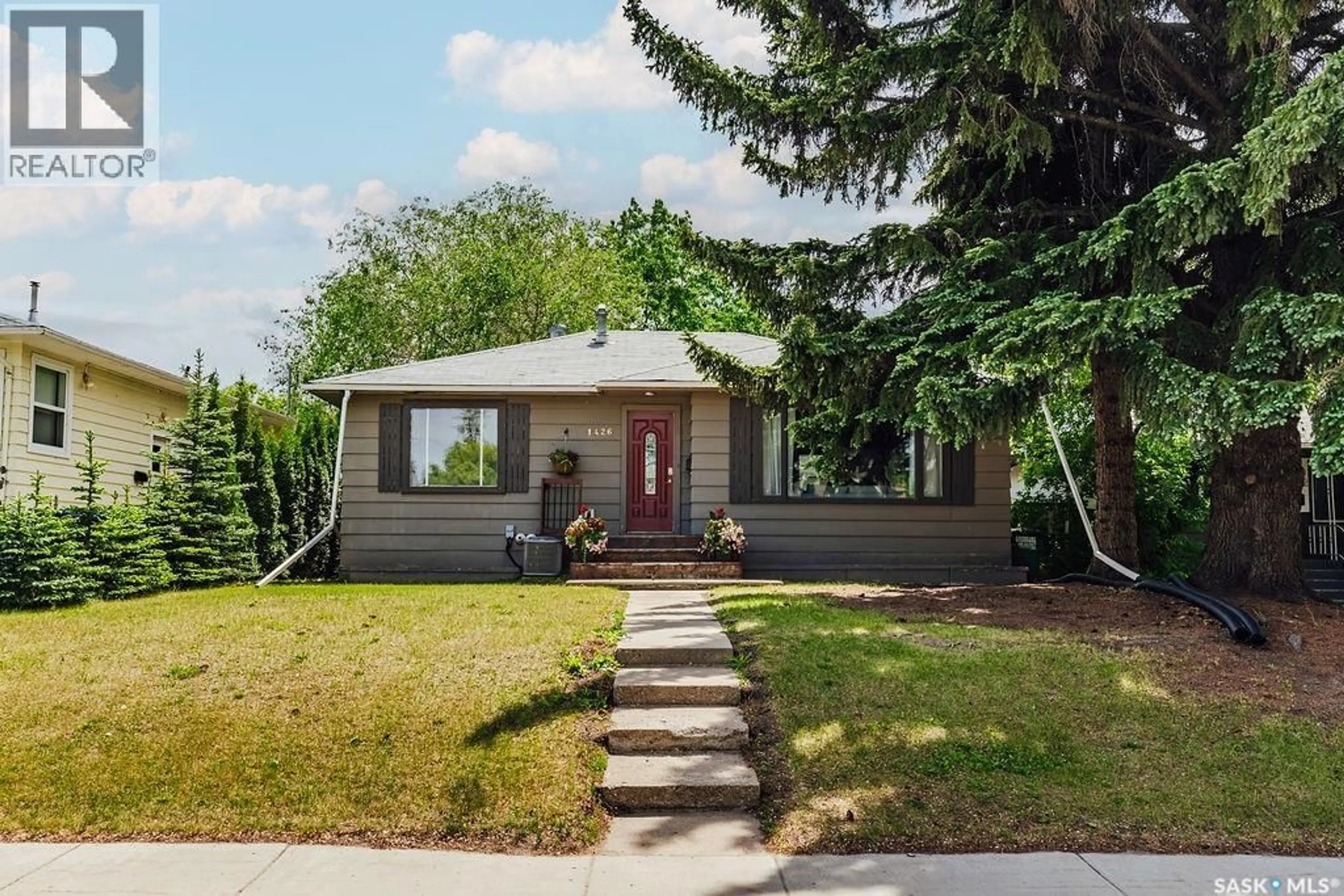 Home with vinyl exterior material, street for 1426 12TH STREET, Saskatoon Saskatchewan S7H0E8