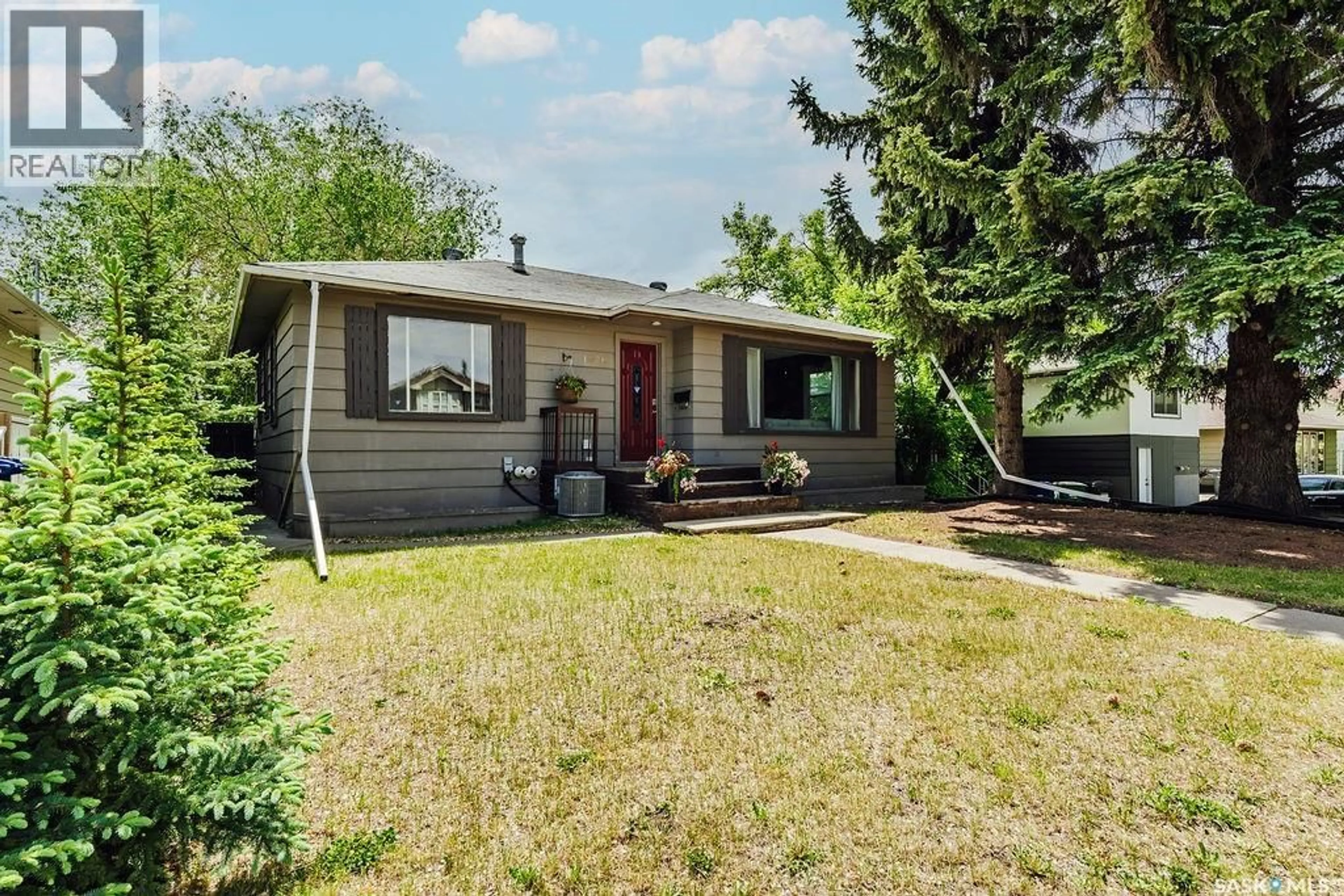 Home with vinyl exterior material, street for 1426 12TH STREET, Saskatoon Saskatchewan S7H0E8