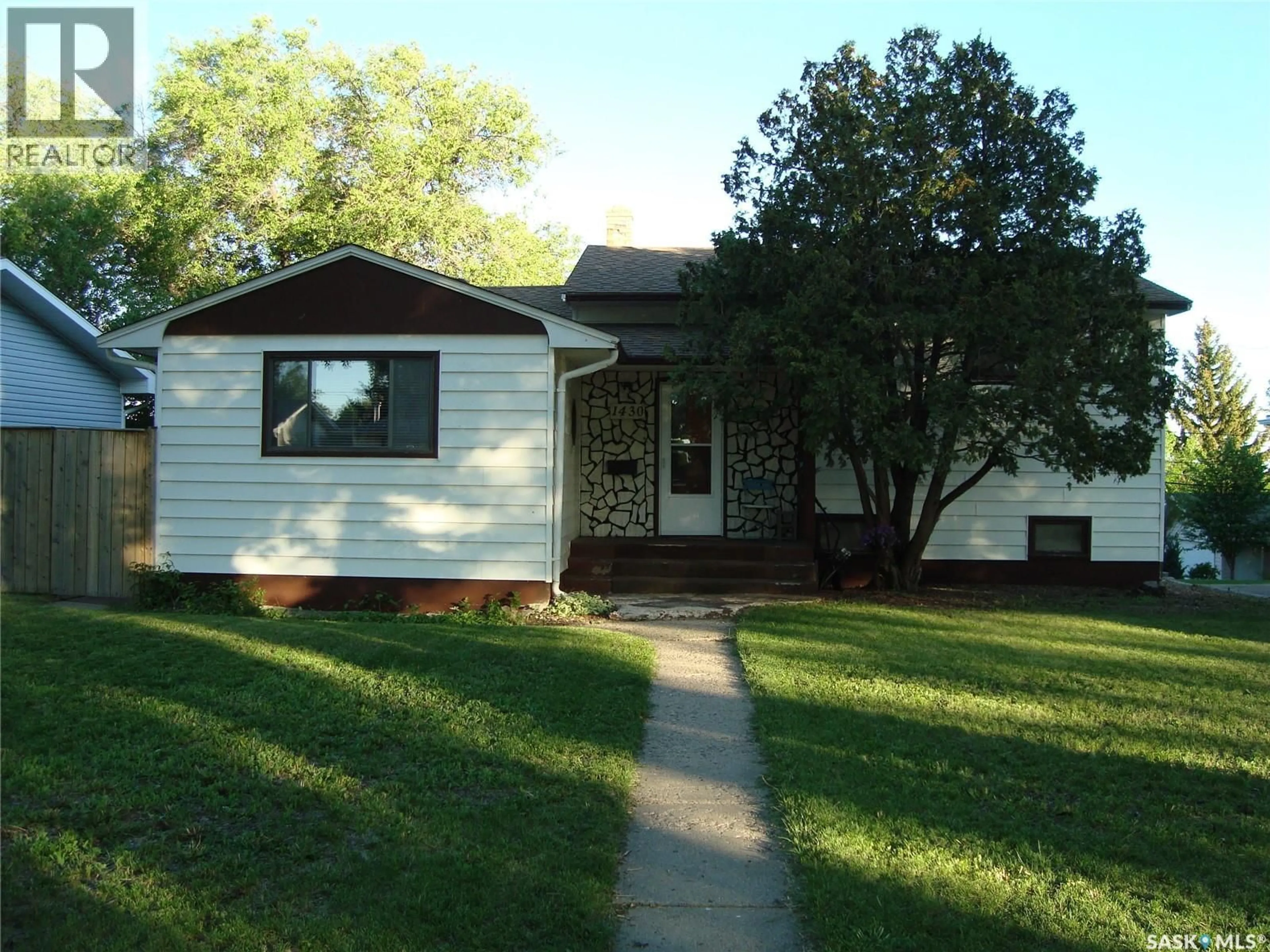 Home with vinyl exterior material, street for 1430 TAYLOR DRIVE, Swift Current Saskatchewan S9H1M9