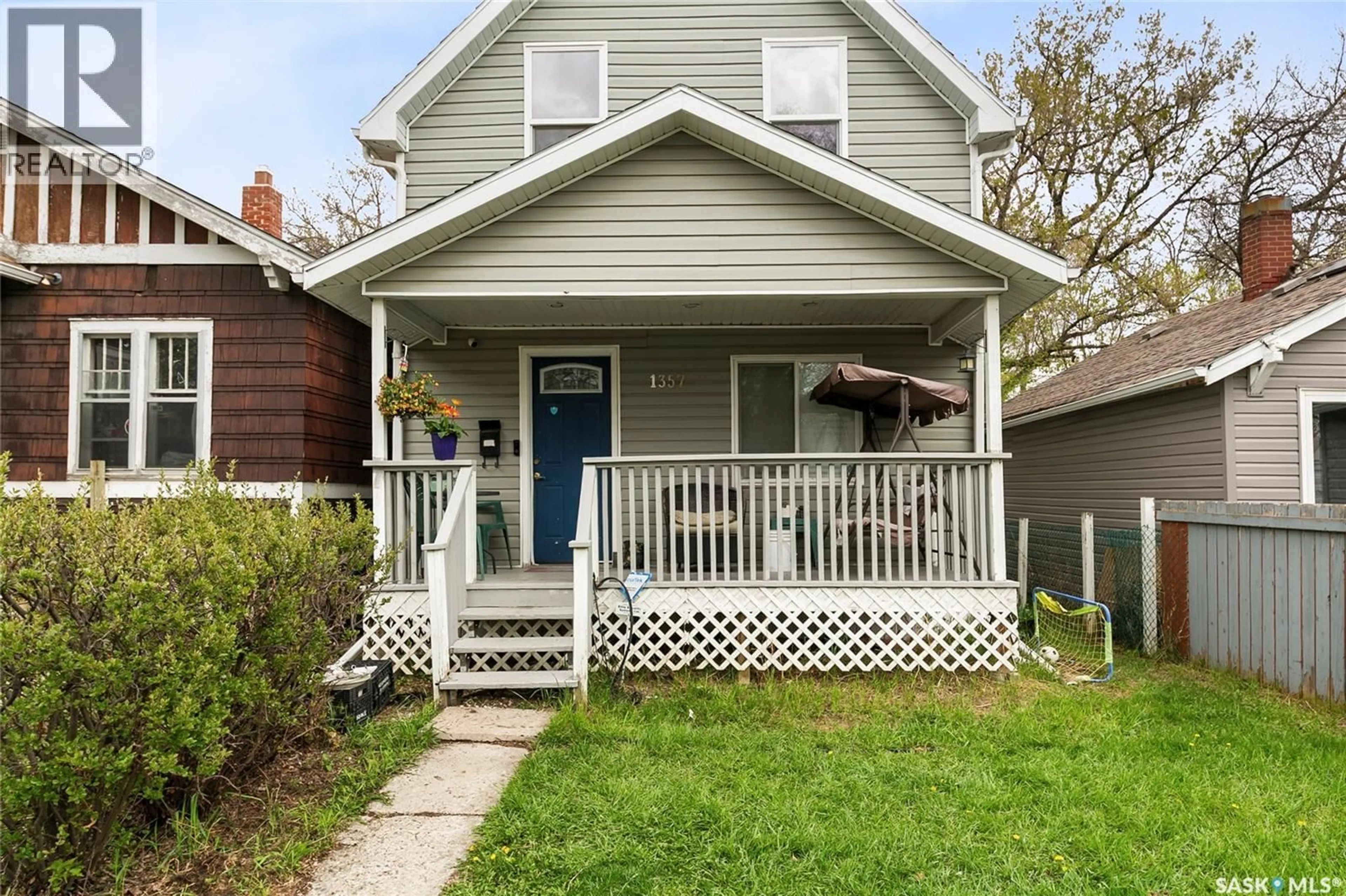 Home with vinyl exterior material, street for 1357 WASCANA STREET, Regina Saskatchewan S4T4J4