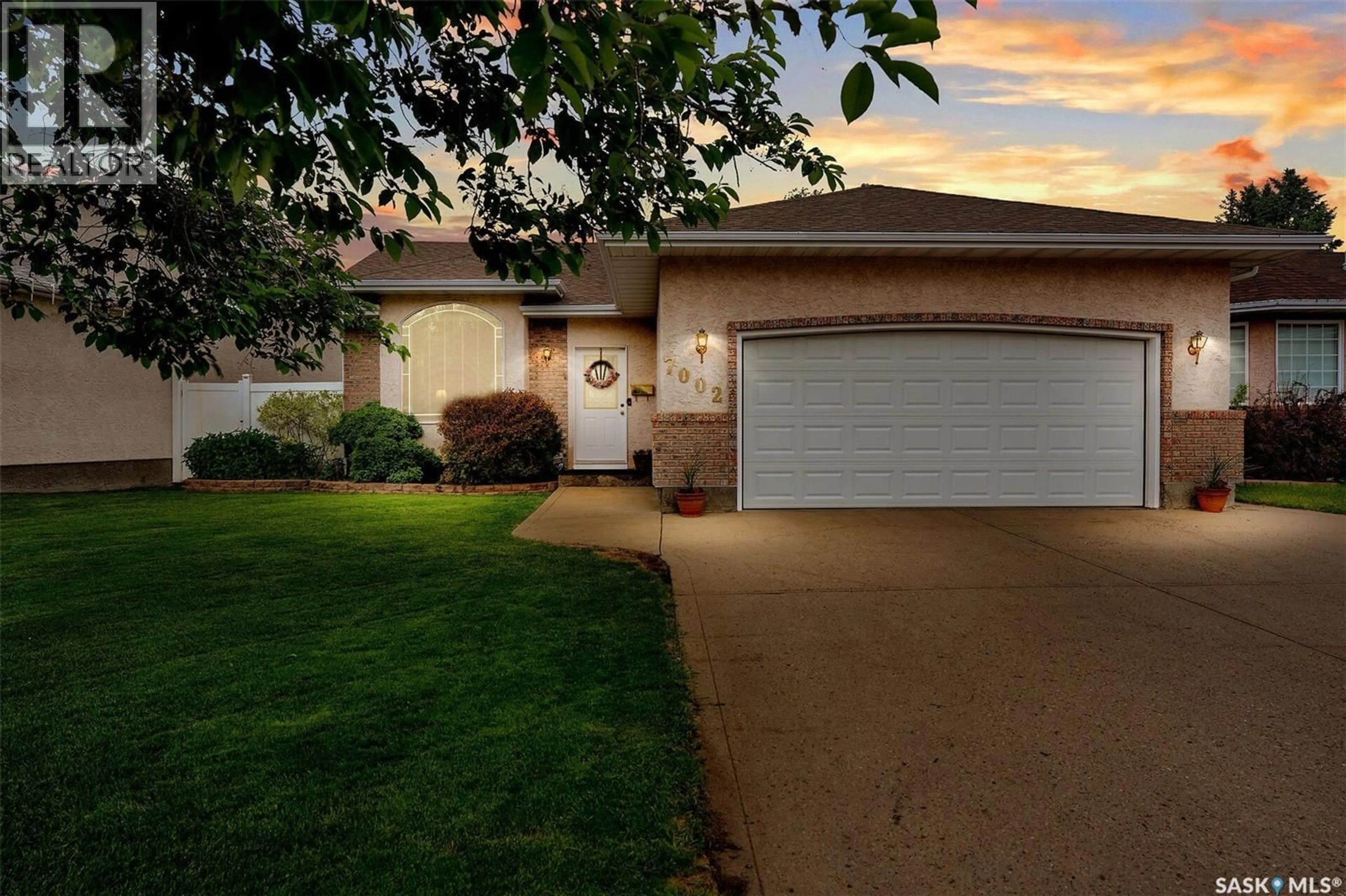 Home with vinyl exterior material, street for 7002 MAPLE WOOD CRESCENT, Regina Saskatchewan S4X4J9