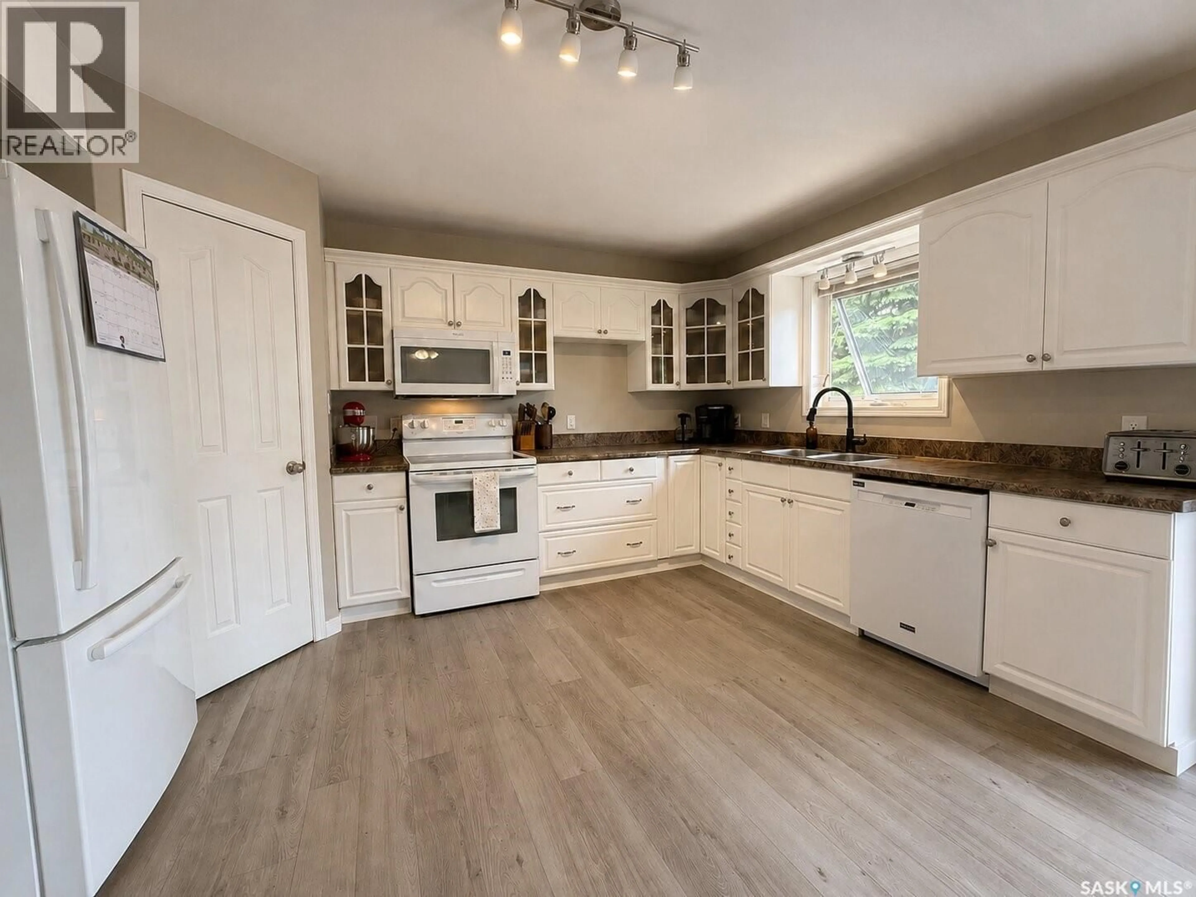 Open concept kitchen, wood/laminate floor for 3007 CENTRAL AVENUE, Laird Saskatchewan S0K2H0