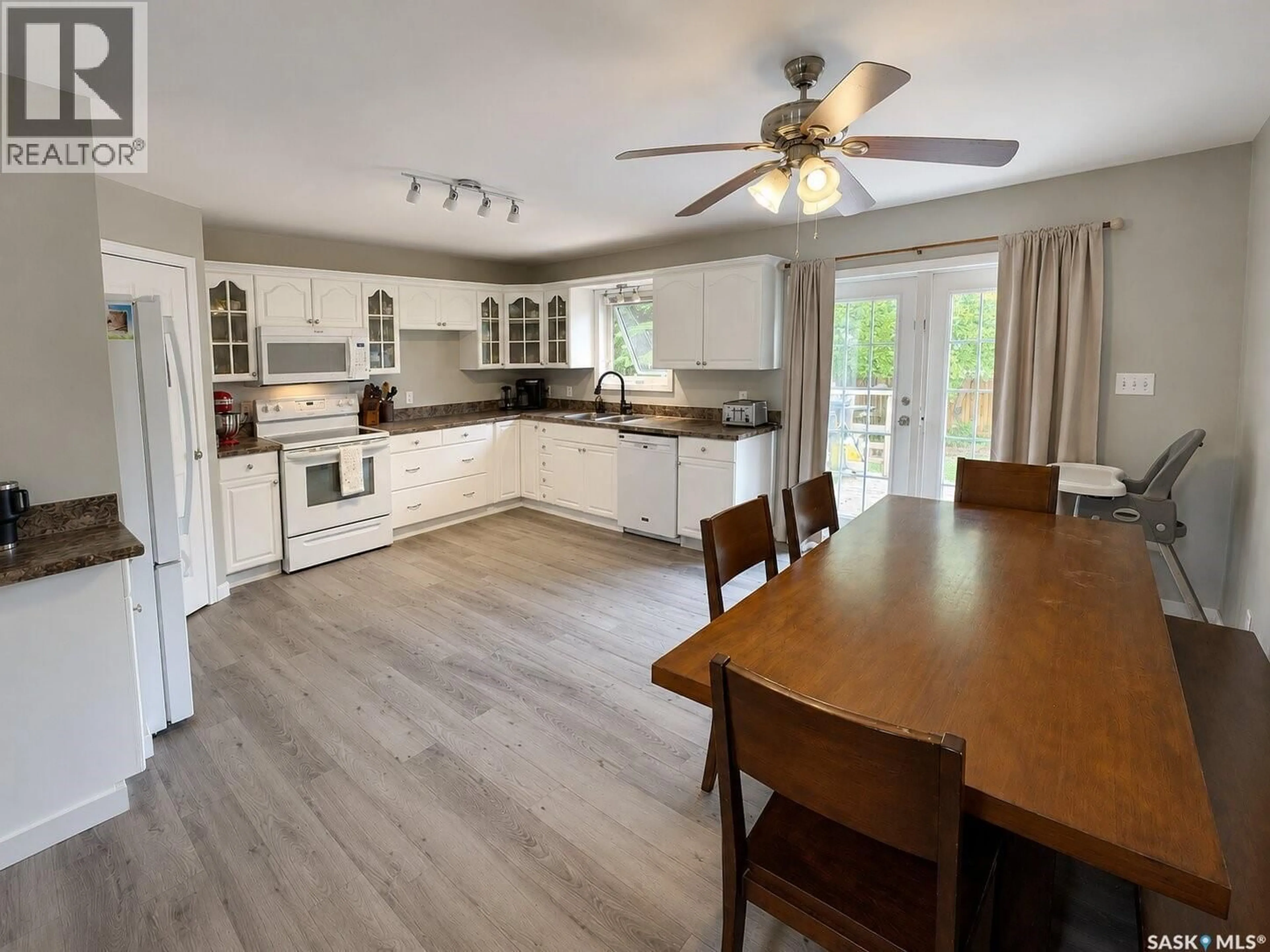 Open concept kitchen, wood/laminate floor for 3007 CENTRAL AVENUE, Laird Saskatchewan S0K2H0
