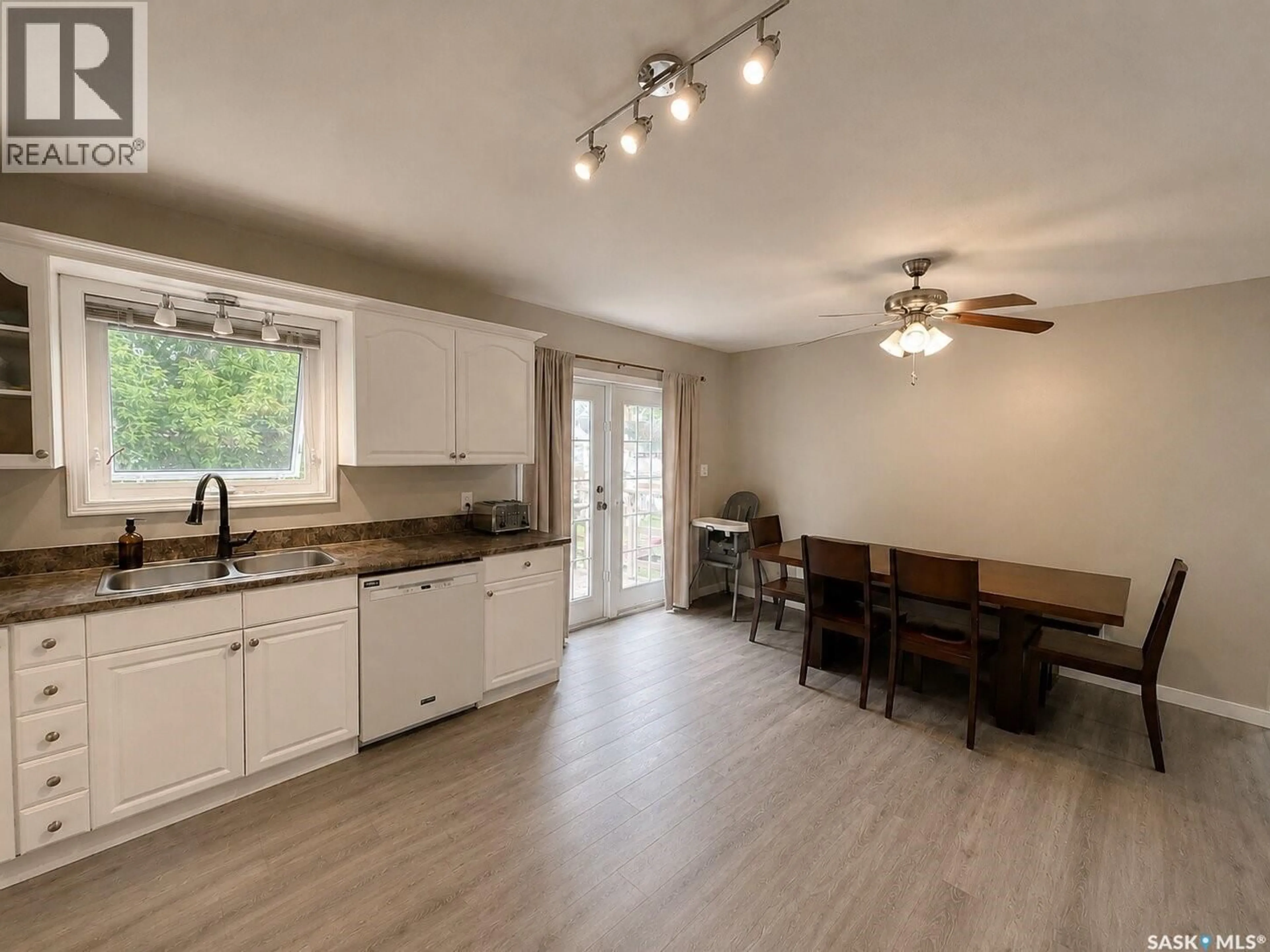 Open concept kitchen, wood/laminate floor for 3007 CENTRAL AVENUE, Laird Saskatchewan S0K2H0