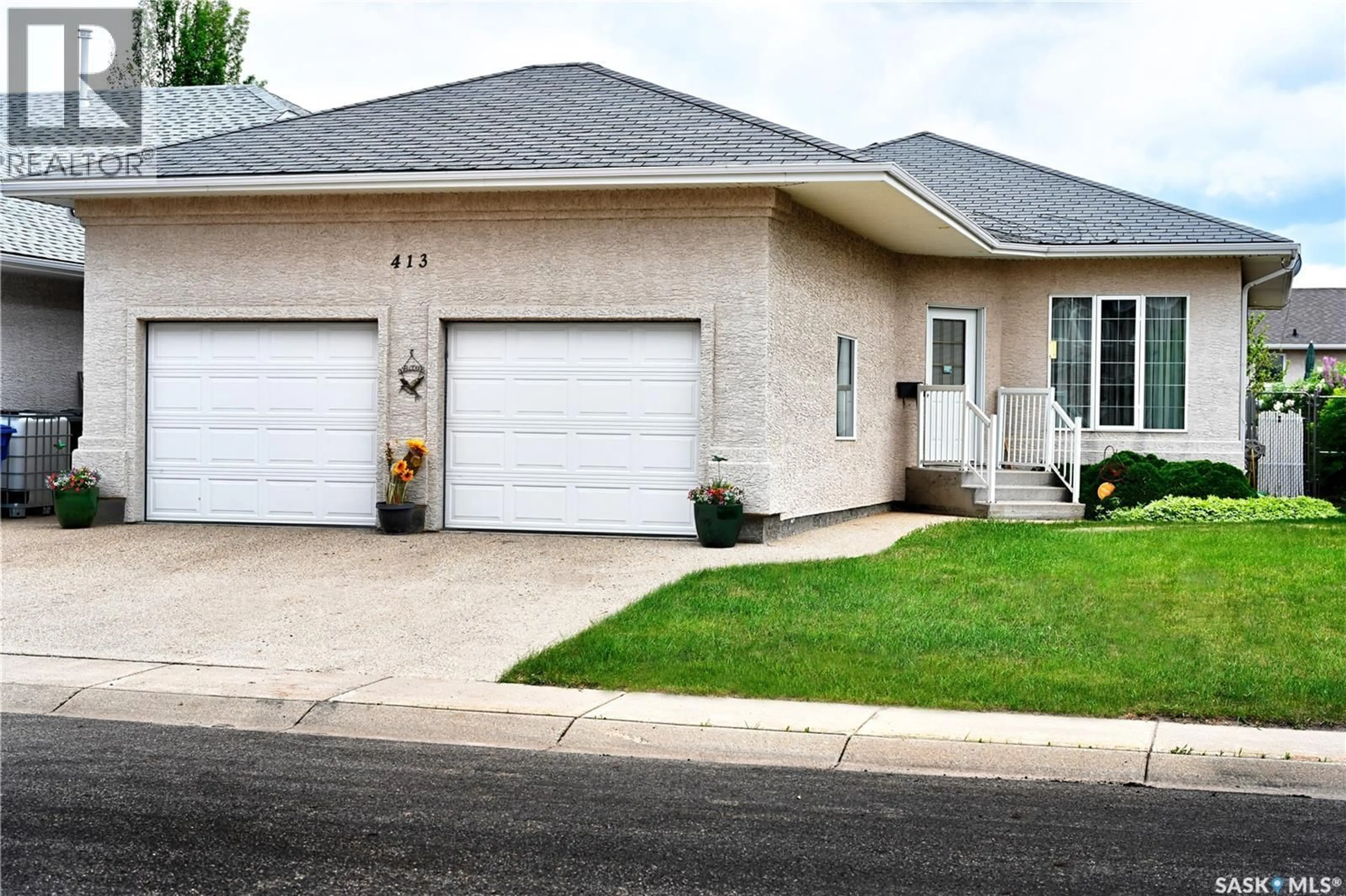 Home with vinyl exterior material, street for 413 CRYSTAL CRESCENT, Warman Saskatchewan S0K0A1