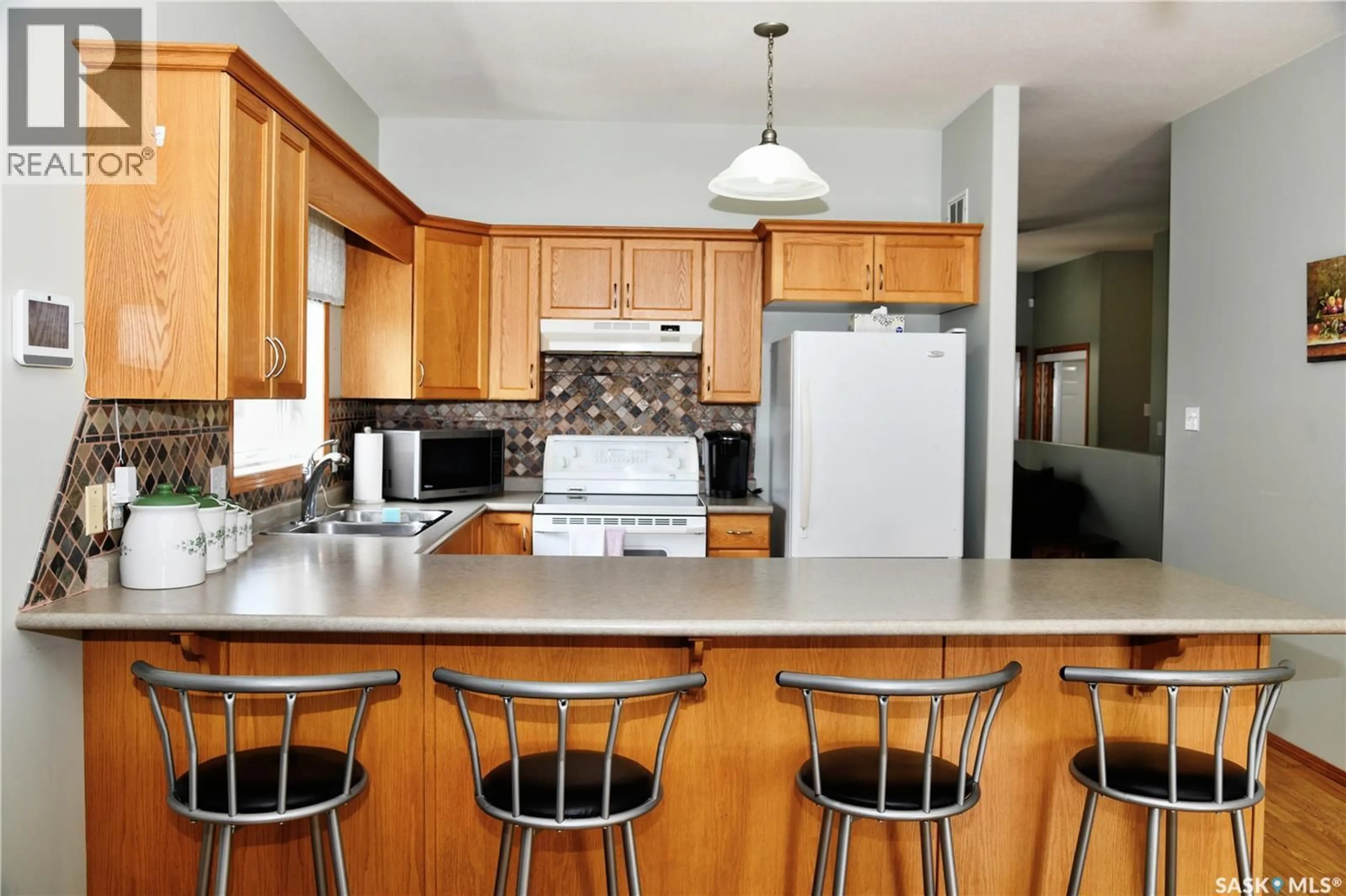 Open concept kitchen, unknown for 413 CRYSTAL CRESCENT, Warman Saskatchewan S0K0A1
