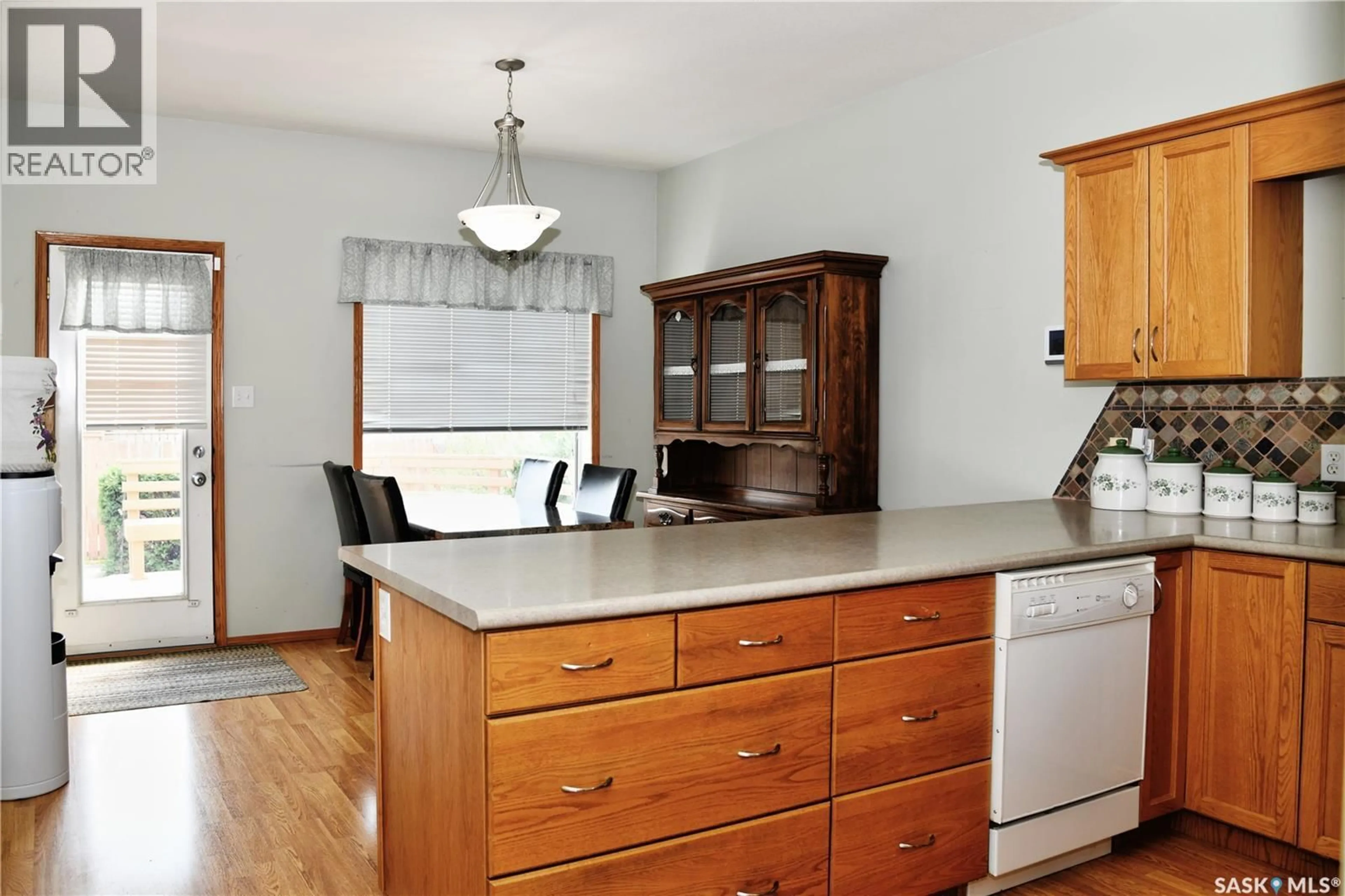 Open concept kitchen, wood/laminate floor for 413 CRYSTAL CRESCENT, Warman Saskatchewan S0K0A1