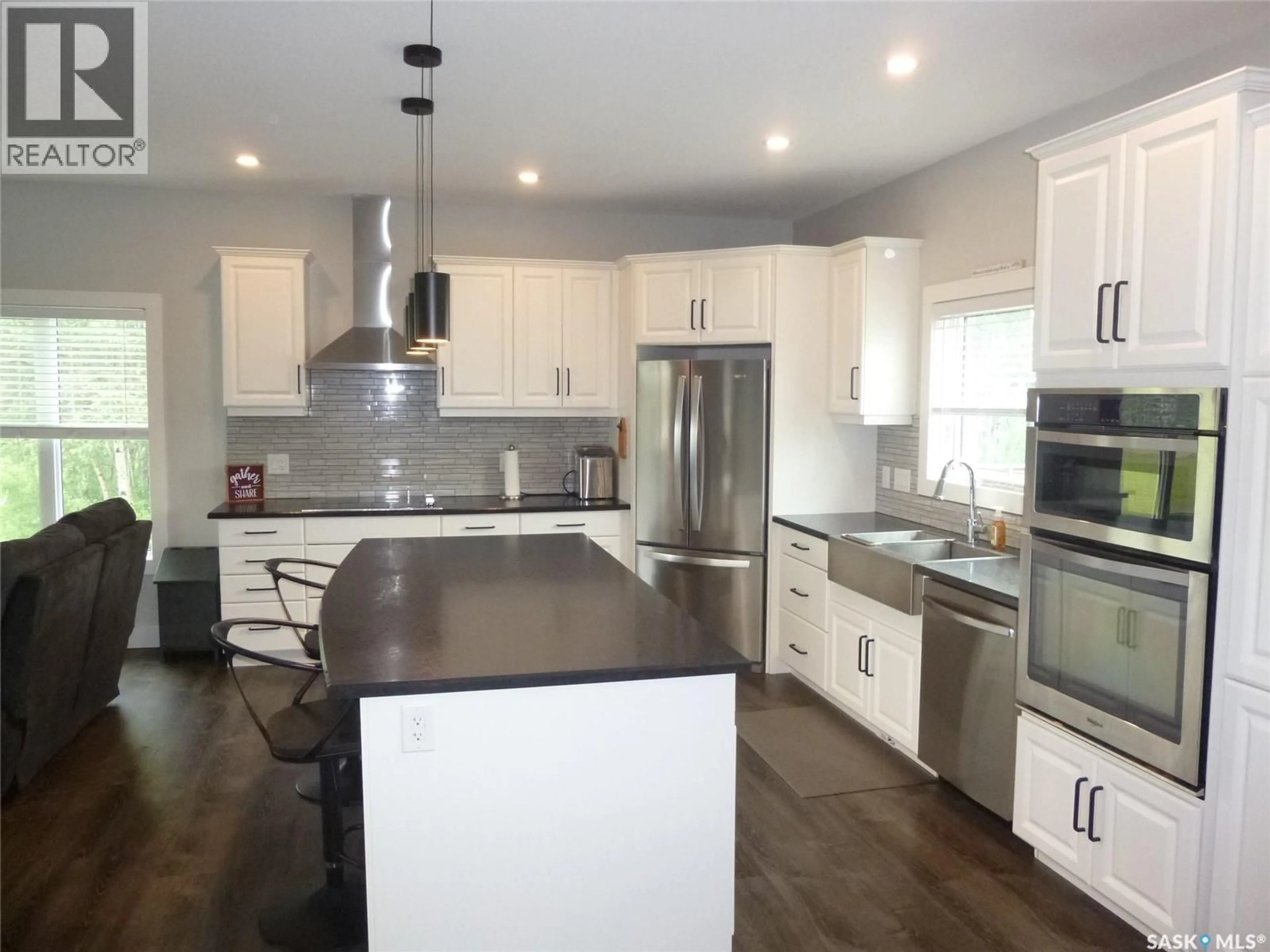 Open concept kitchen, wood/laminate floor for ELL ACREAGE, Edenwold Saskatchewan S0G3Z0