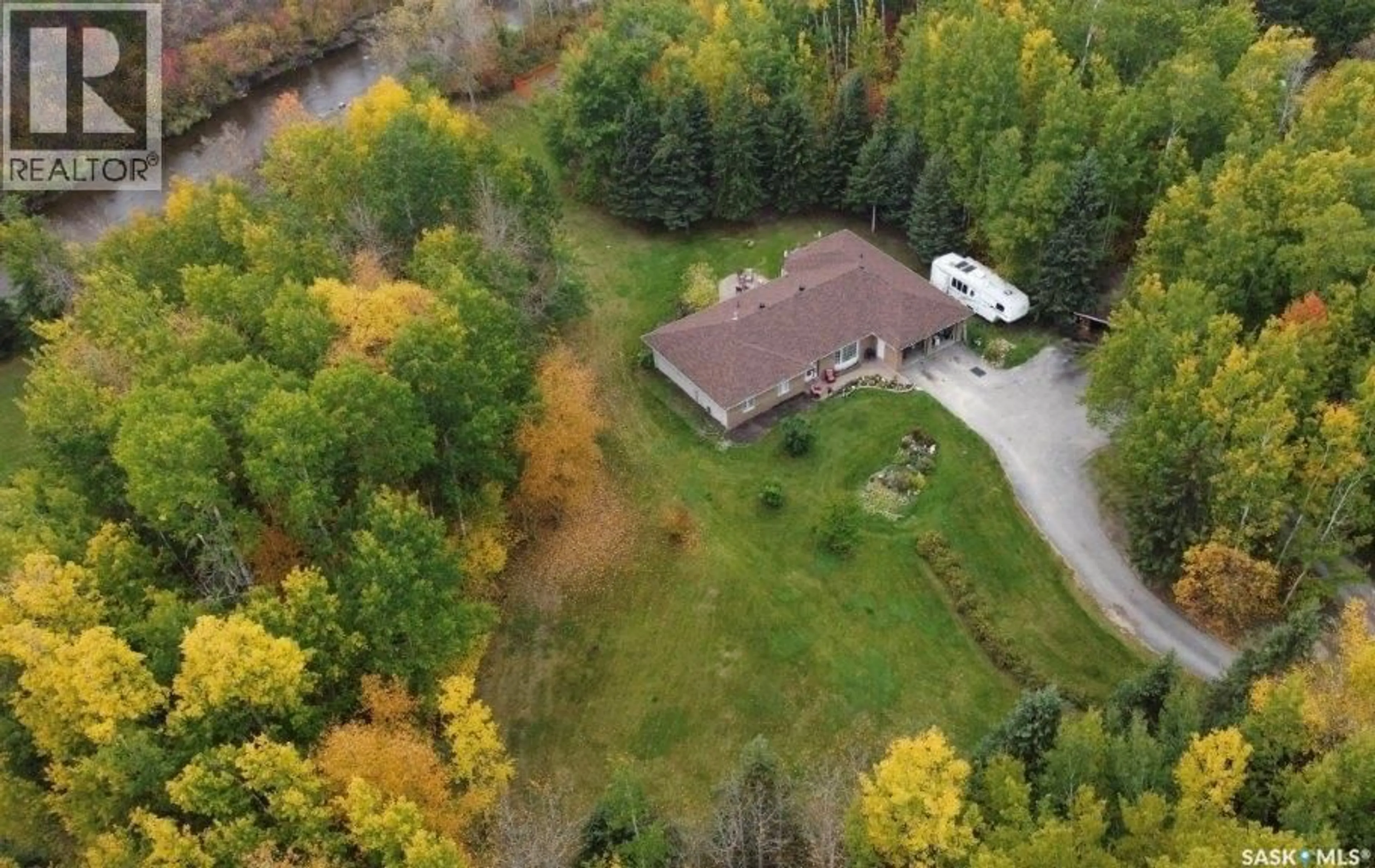 A pic from outside/outdoor area/front of a property/back of a property/a pic from drone, water/lake/river/ocean view for 4.11 WIZEWOOD ROAD, Hudson Bay Rm No. 394 Saskatchewan S0E0Y0