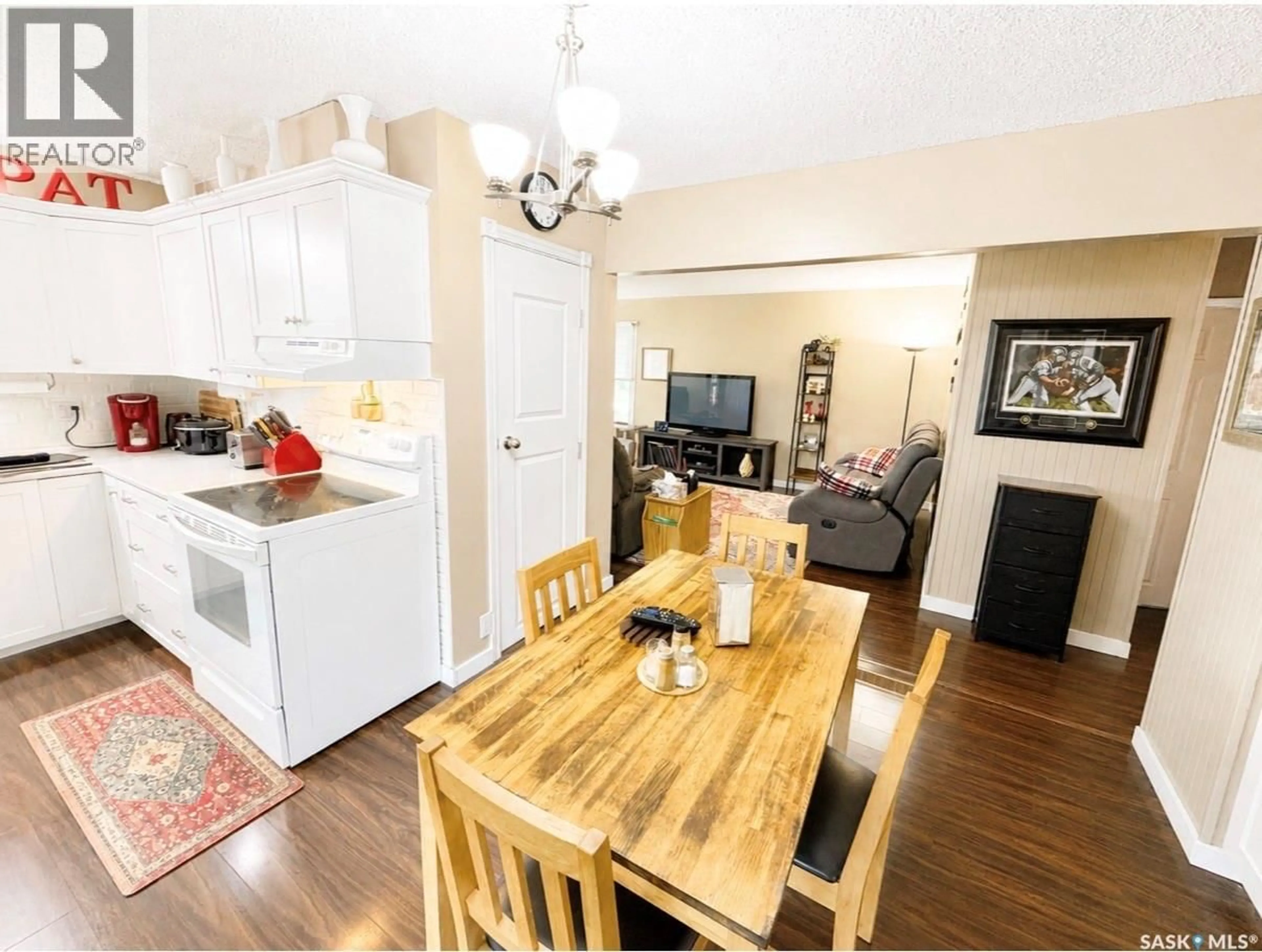 Open concept kitchen, wood/laminate floor for 416 REED STREET, Morse Saskatchewan S0H3C0