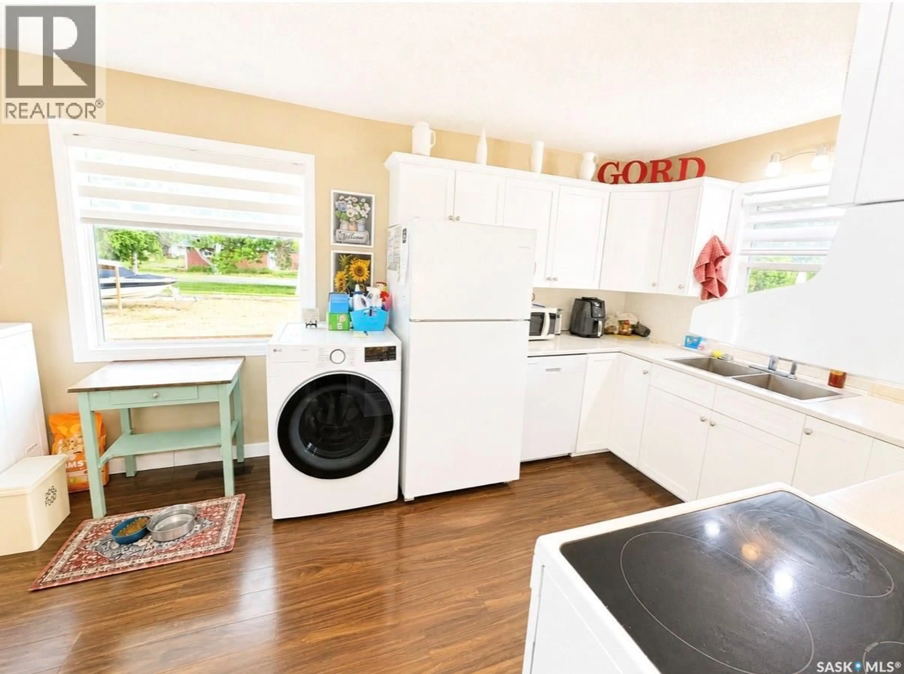 Kitchen with laundary machines, unknown for 416 REED STREET, Morse Saskatchewan S0H3C0