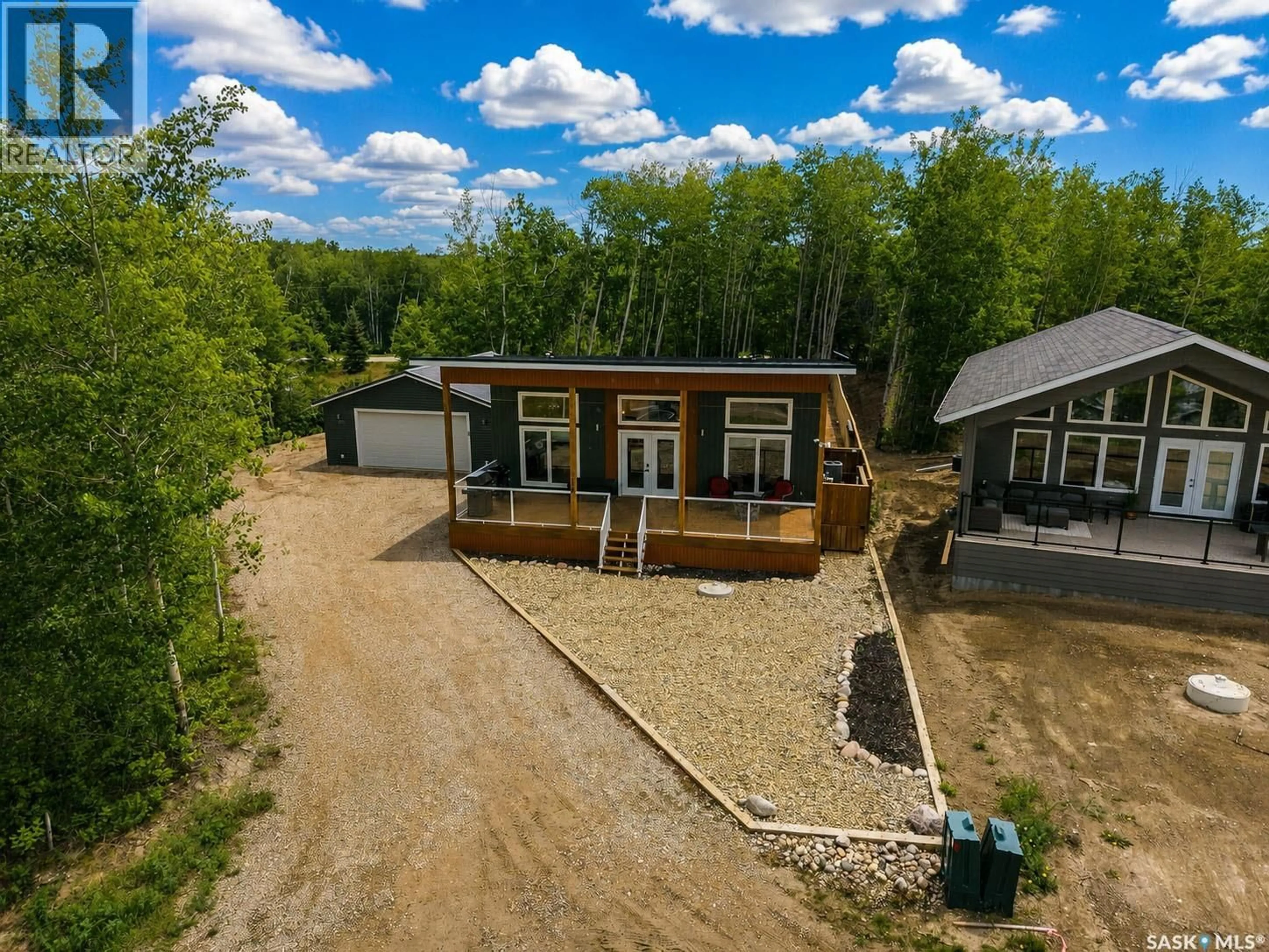 A pic from outside/outdoor area/front of a property/back of a property/a pic from drone, unknown for 115 JACOBSON COVE, Lakeland Rm No. 521 Saskatchewan S0J0N0