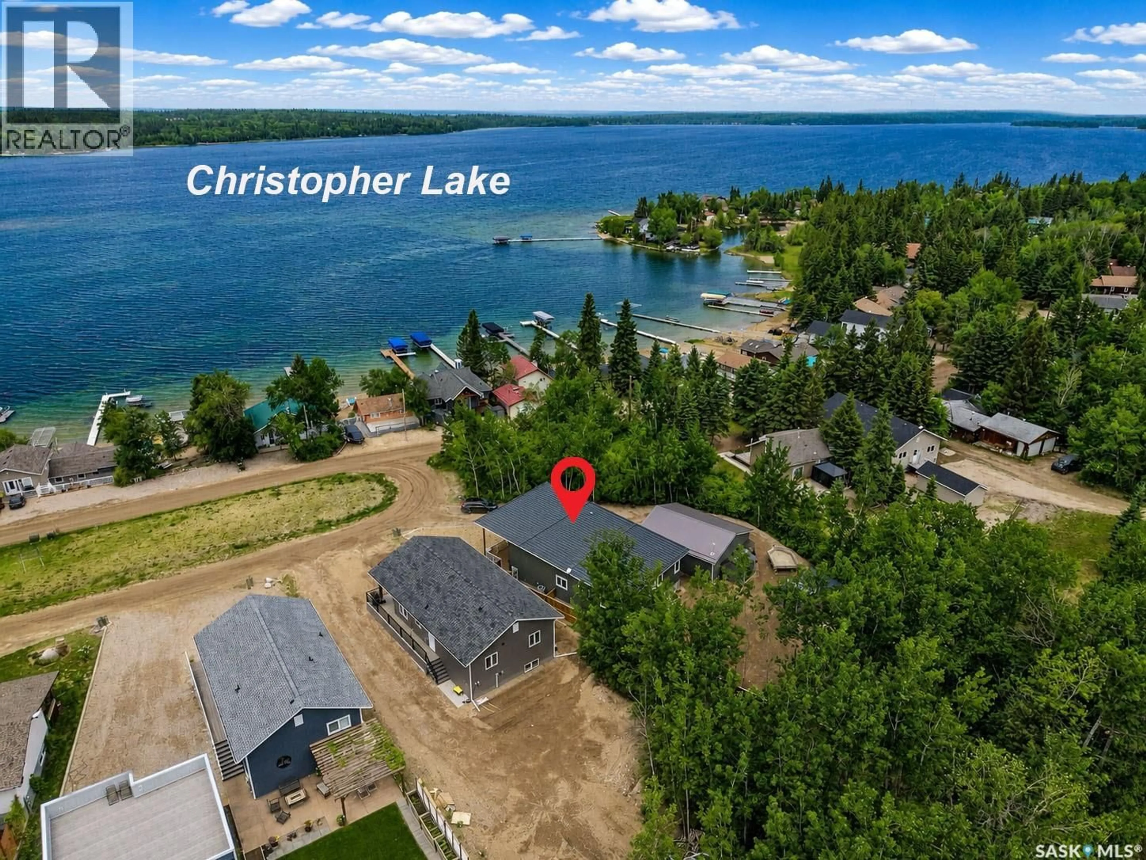 A pic from outside/outdoor area/front of a property/back of a property/a pic from drone, water/lake/river/ocean view for 115 JACOBSON COVE, Lakeland Rm No. 521 Saskatchewan S0J0N0