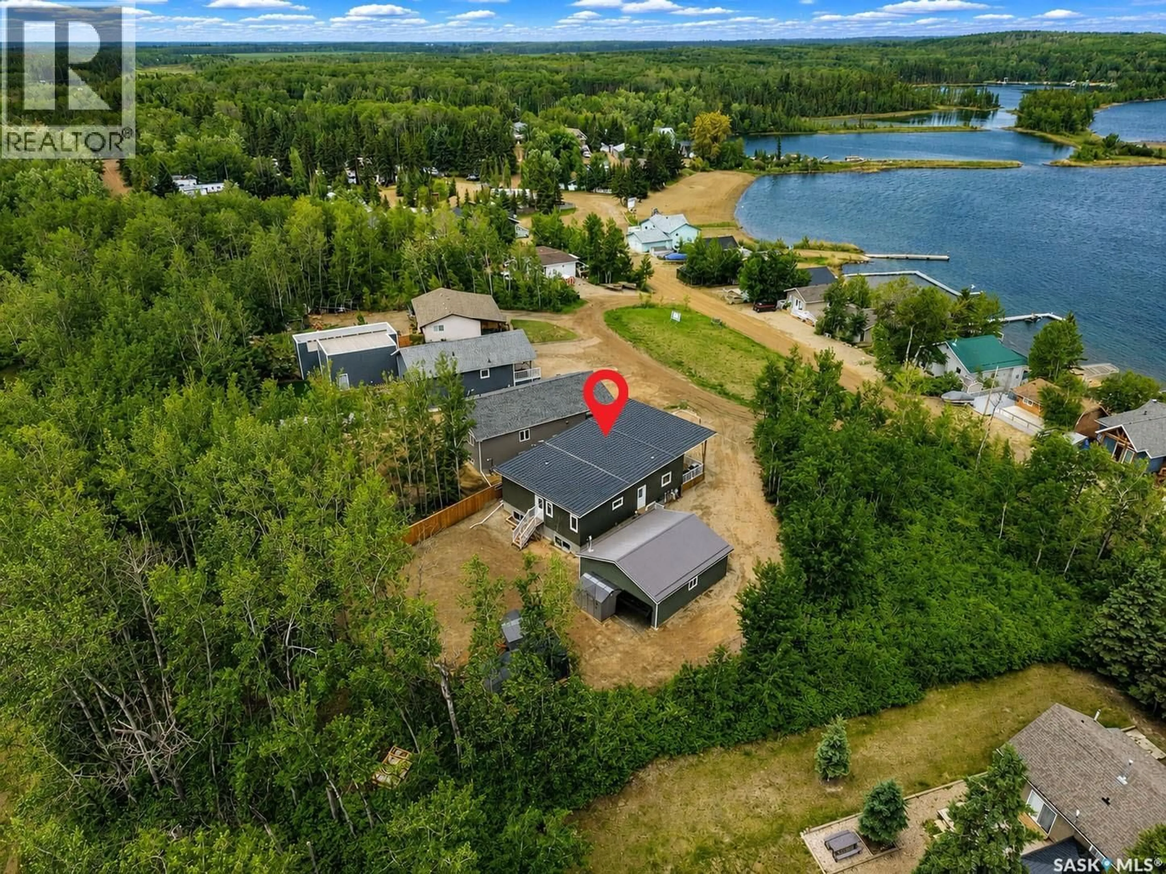 A pic from outside/outdoor area/front of a property/back of a property/a pic from drone, water/lake/river/ocean view for 115 JACOBSON COVE, Lakeland Rm No. 521 Saskatchewan S0J0N0