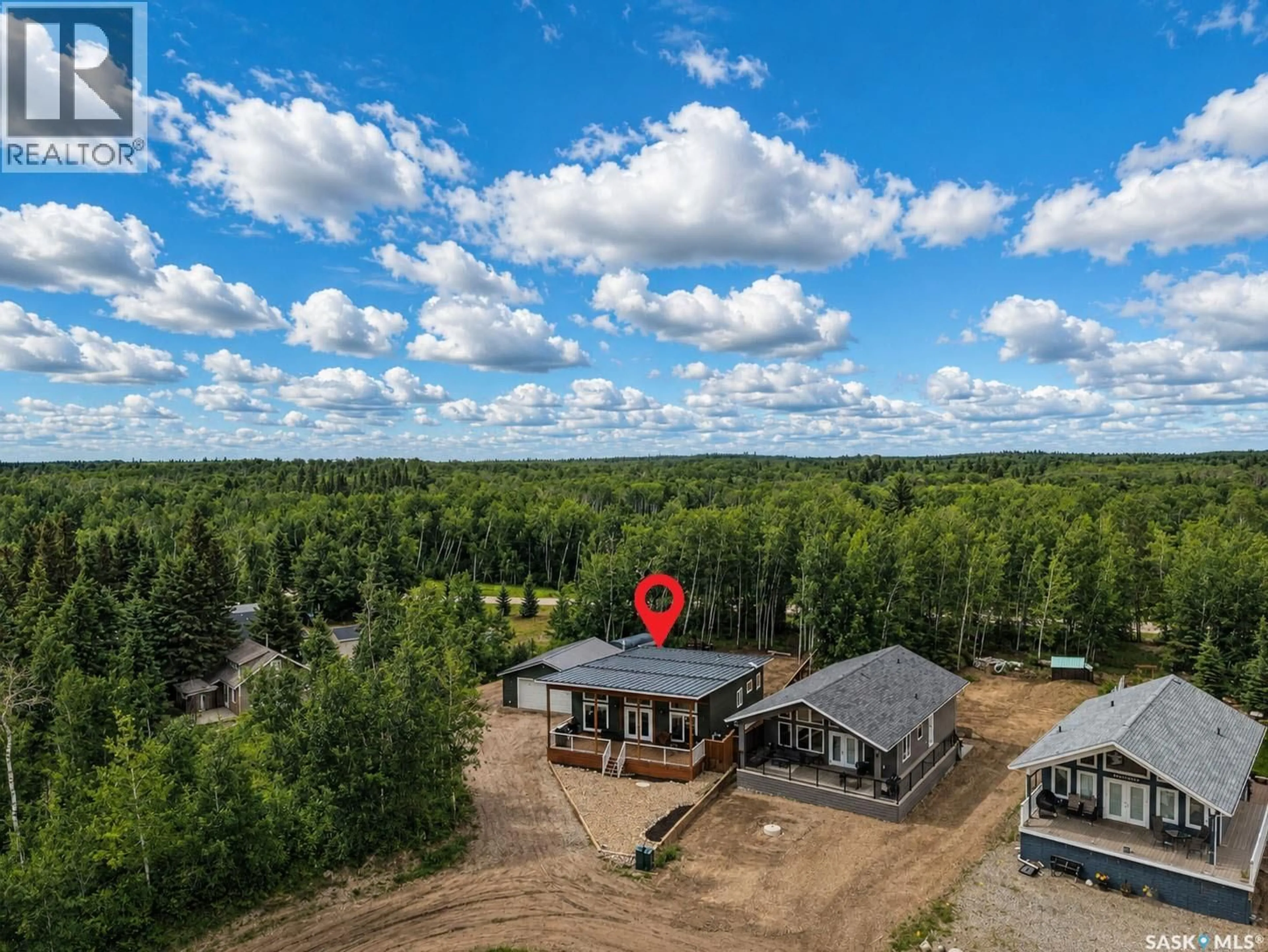 A pic from outside/outdoor area/front of a property/back of a property/a pic from drone, forest/trees view for 115 JACOBSON COVE, Lakeland Rm No. 521 Saskatchewan S0J0N0
