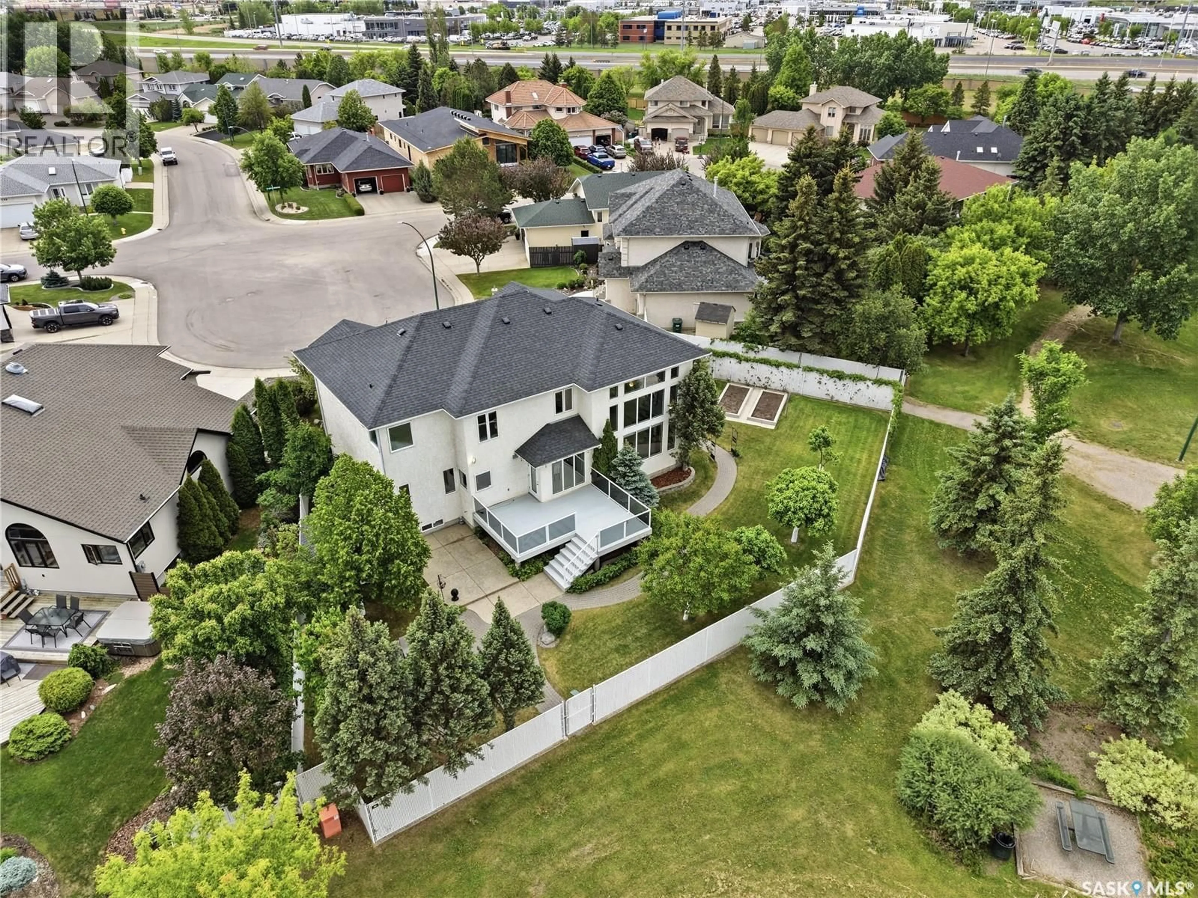 A pic from outside/outdoor area/front of a property/back of a property/a pic from drone, street for 214 MENDEL GREEN, Saskatoon Saskatchewan S7J5J7
