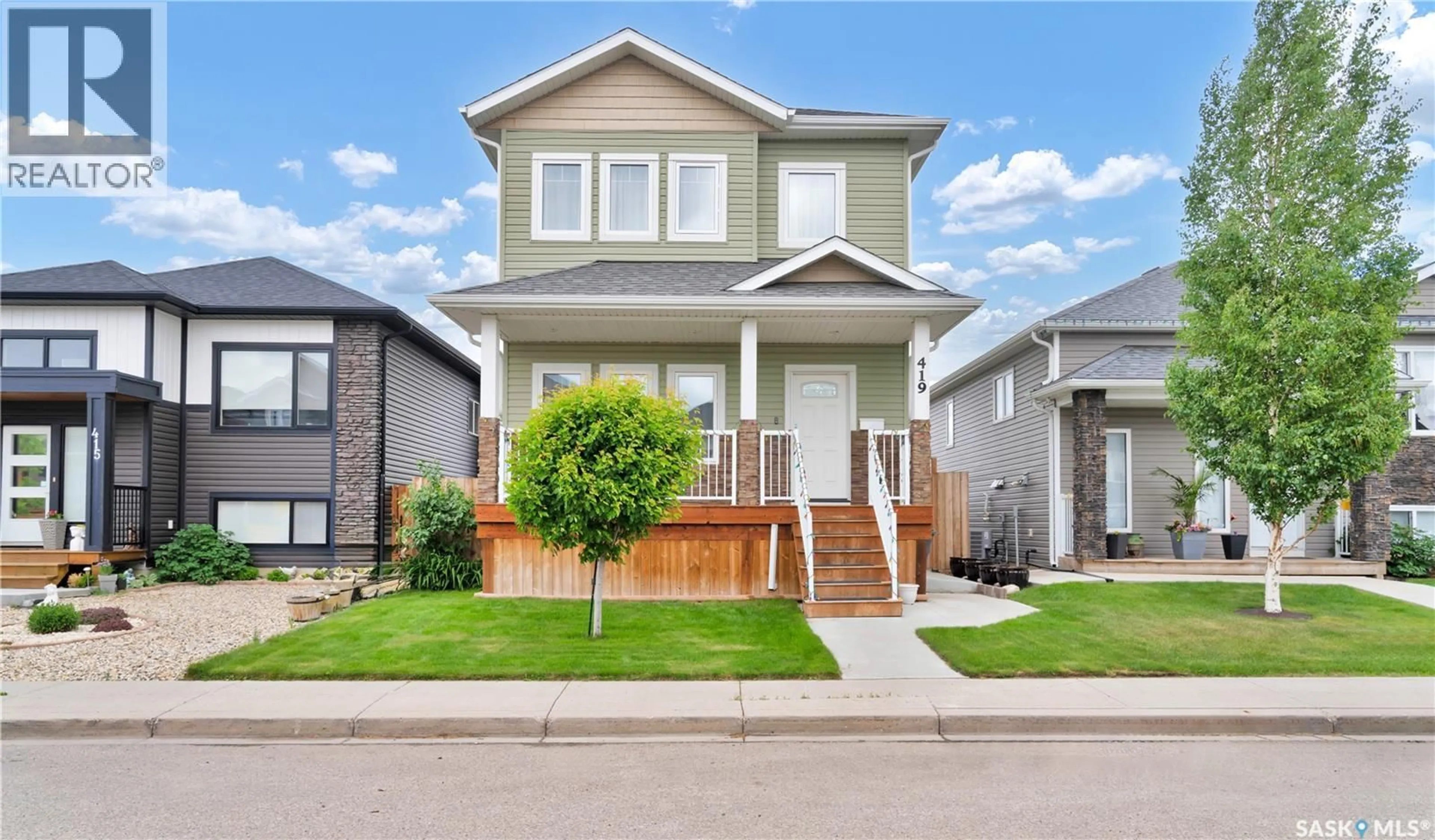 Home with vinyl exterior material, street for 419 ELLS WAY, Saskatoon Saskatchewan S7L6K8