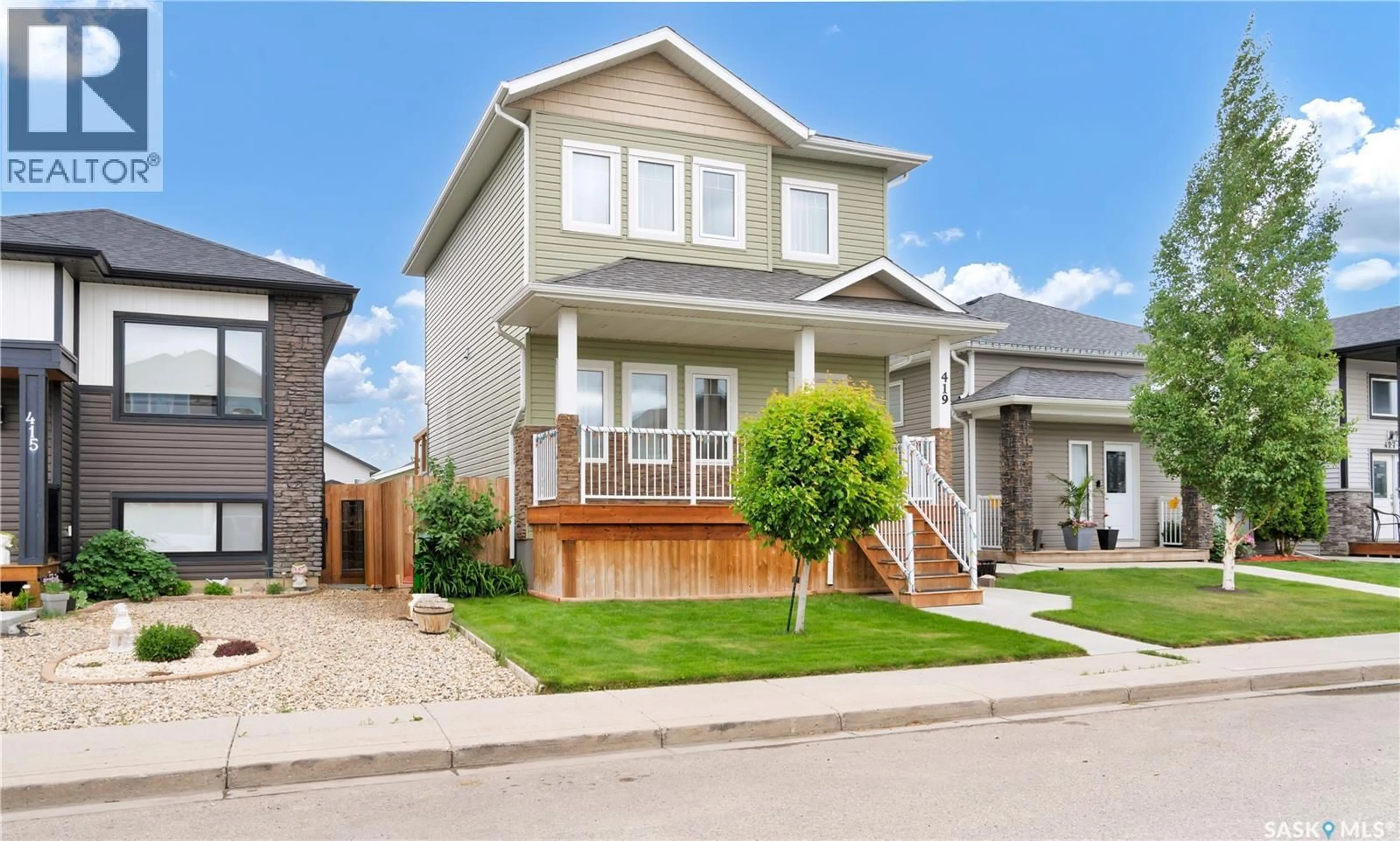 Home with vinyl exterior material, street for 419 ELLS WAY, Saskatoon Saskatchewan S7L6K8