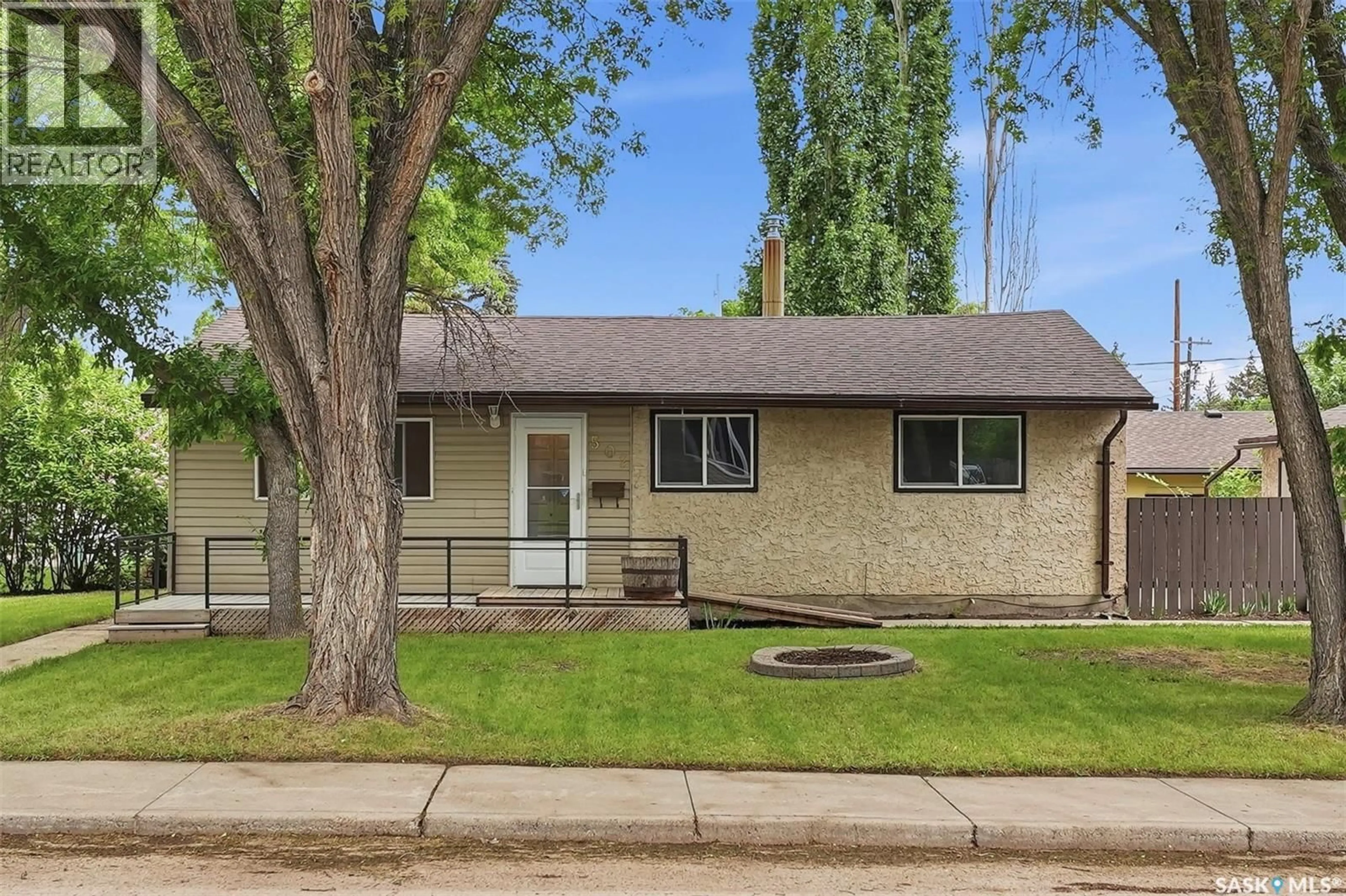 Home with vinyl exterior material, street for 502 X AVENUE, Saskatoon Saskatchewan S7L3K2