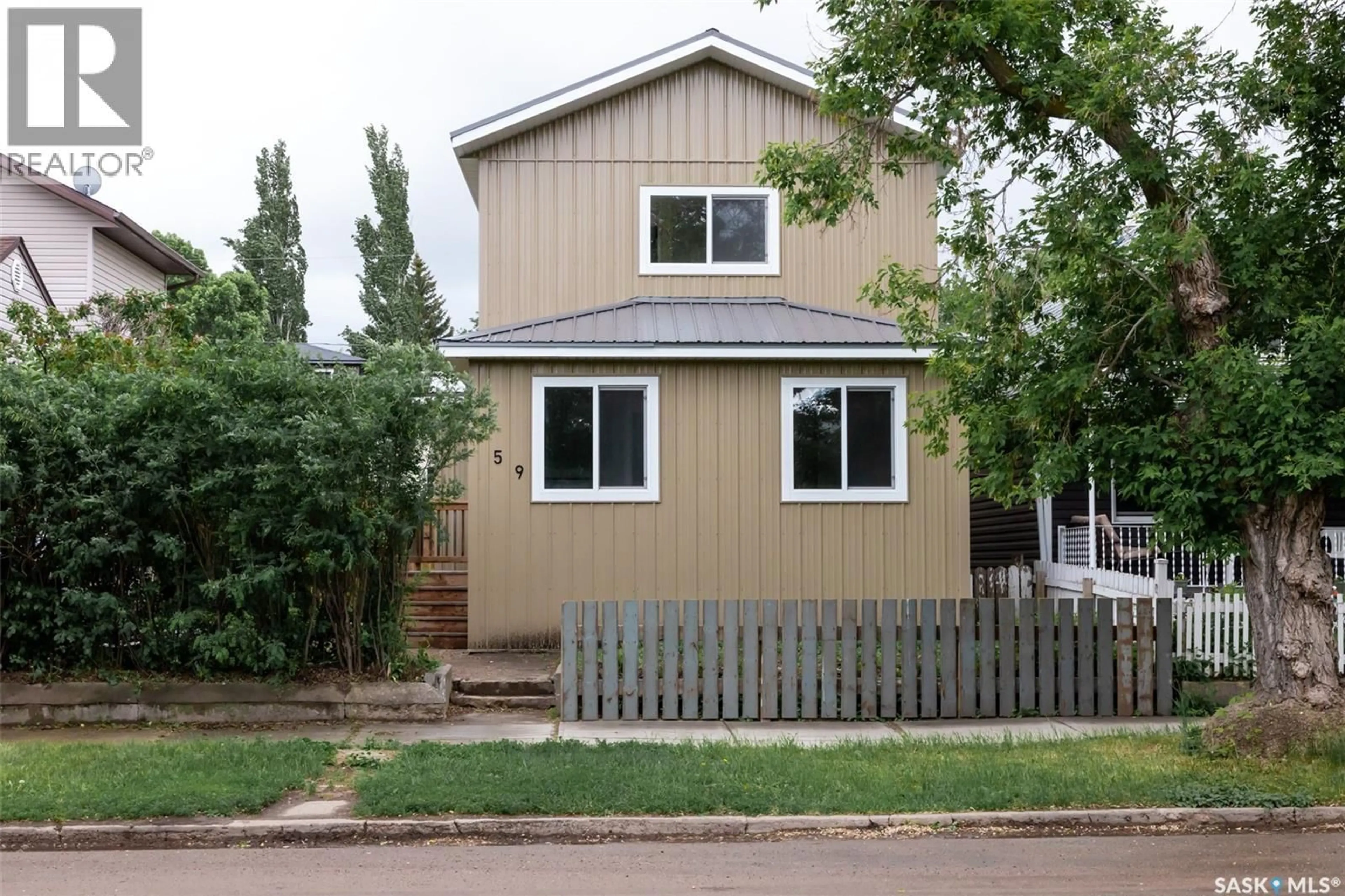 Home with vinyl exterior material, street for 59 LILLOOET STREET, Moose Jaw Saskatchewan S6H4S3