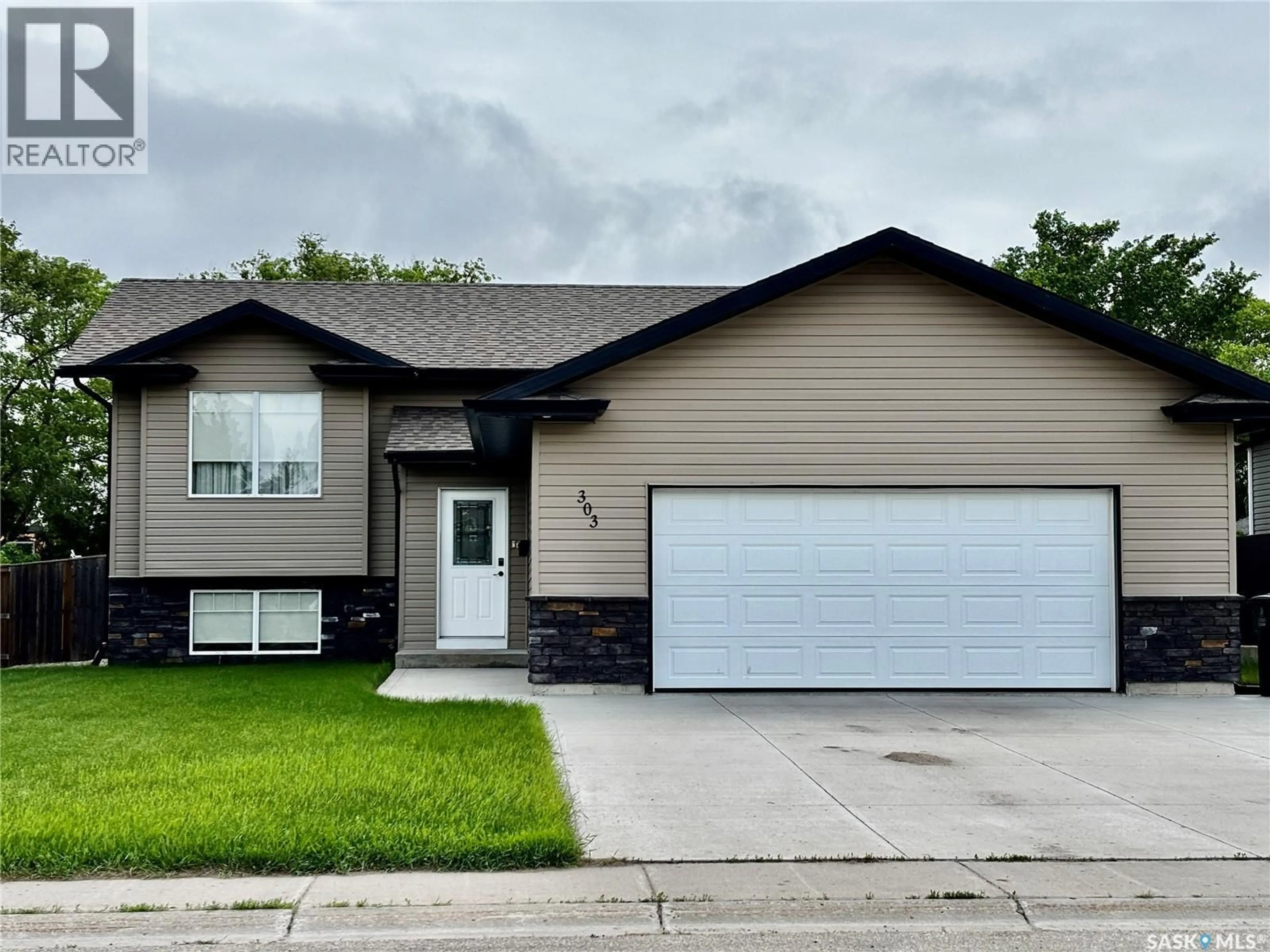 Home with vinyl exterior material, street for 303 DIEFENBAKER AVENUE, Hague Saskatchewan S0K1X0