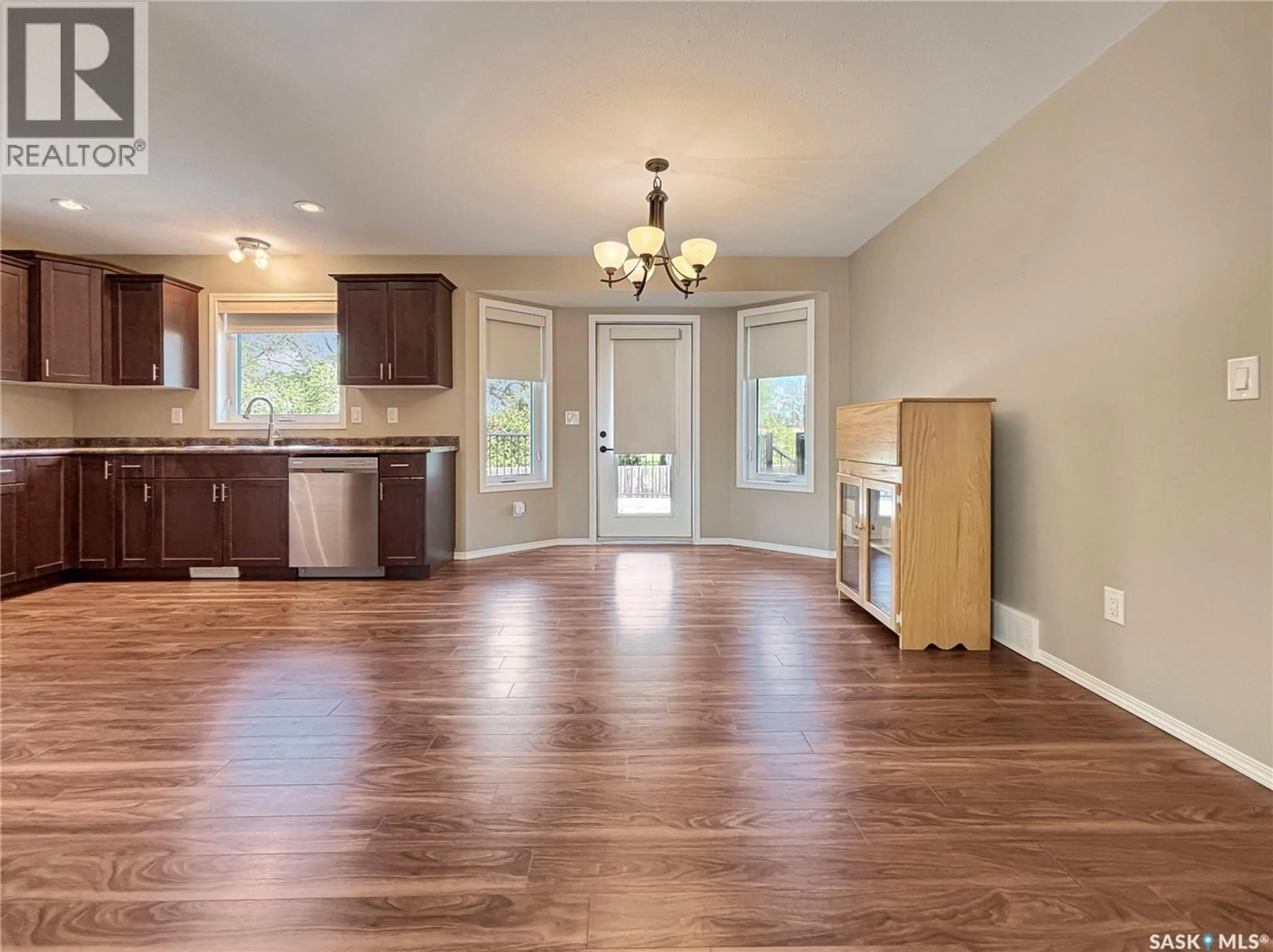 Open concept kitchen, wood/laminate floor for 303 DIEFENBAKER AVENUE, Hague Saskatchewan S0K1X0