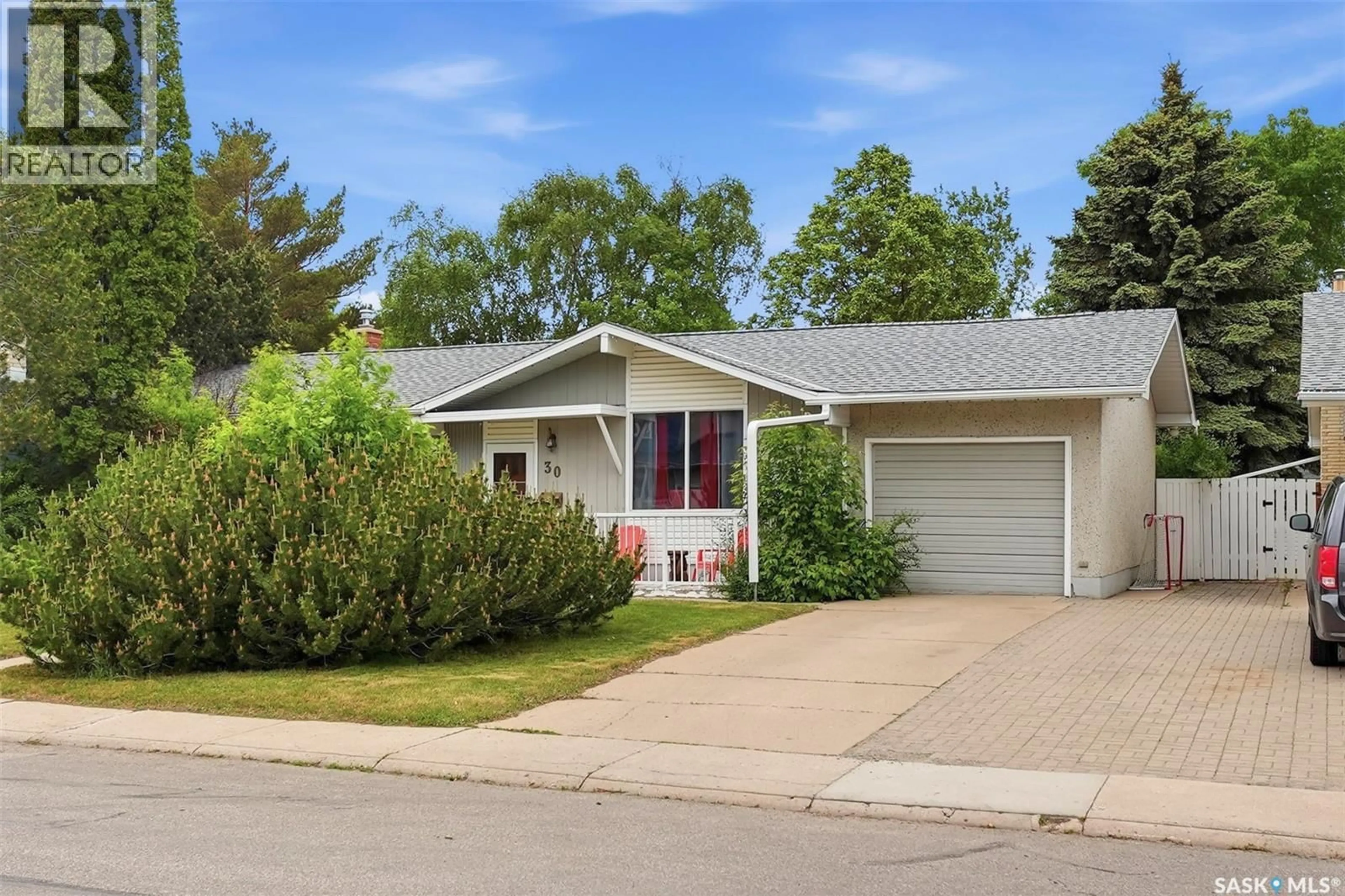 Home with vinyl exterior material, street for 30 RIEL CRESCENT, Saskatoon Saskatchewan S7J2W6