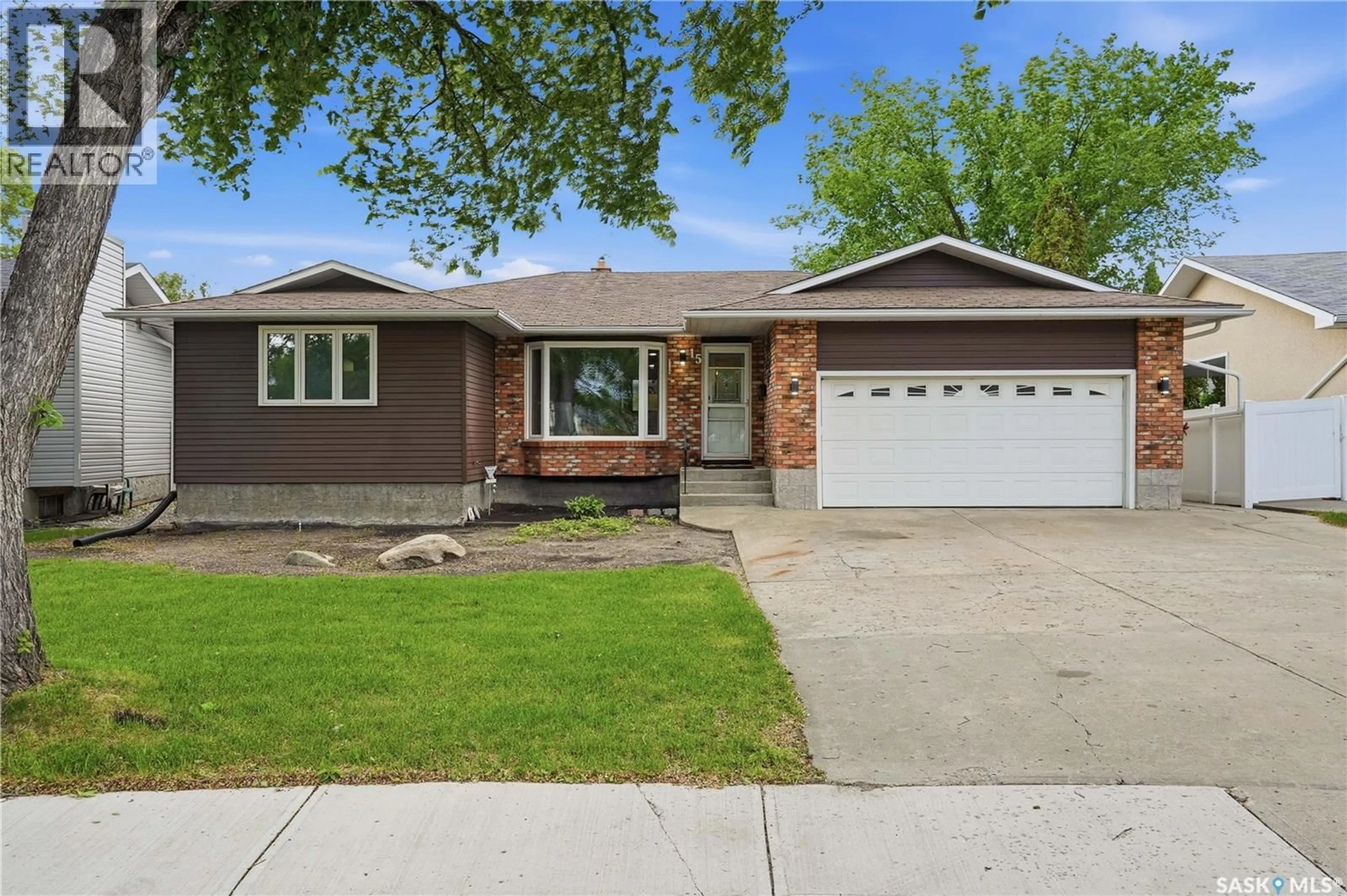 Home with vinyl exterior material, street for 15 MINOT DRIVE, Regina Saskatchewan S4X1B5