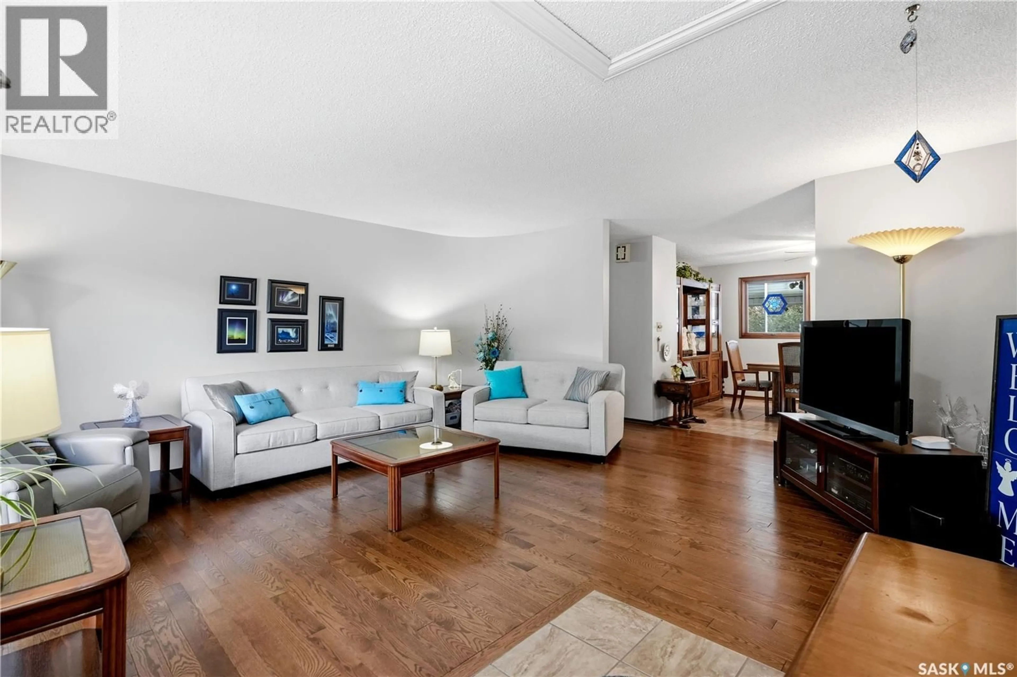 Living room with furniture, wood/laminate floor for 15 MINOT DRIVE, Regina Saskatchewan S4X1B5