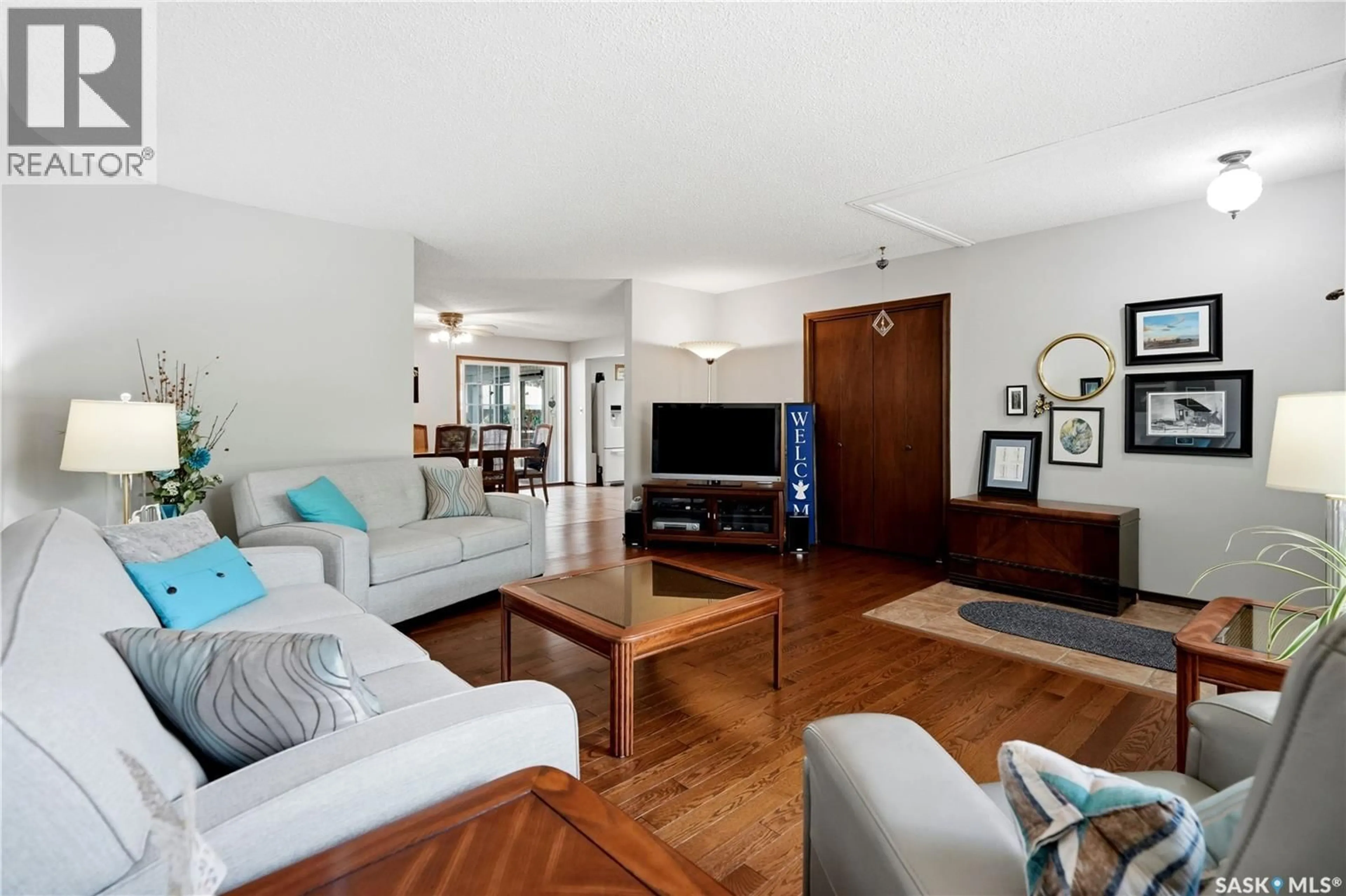 Living room with furniture, wood/laminate floor for 15 MINOT DRIVE, Regina Saskatchewan S4X1B5