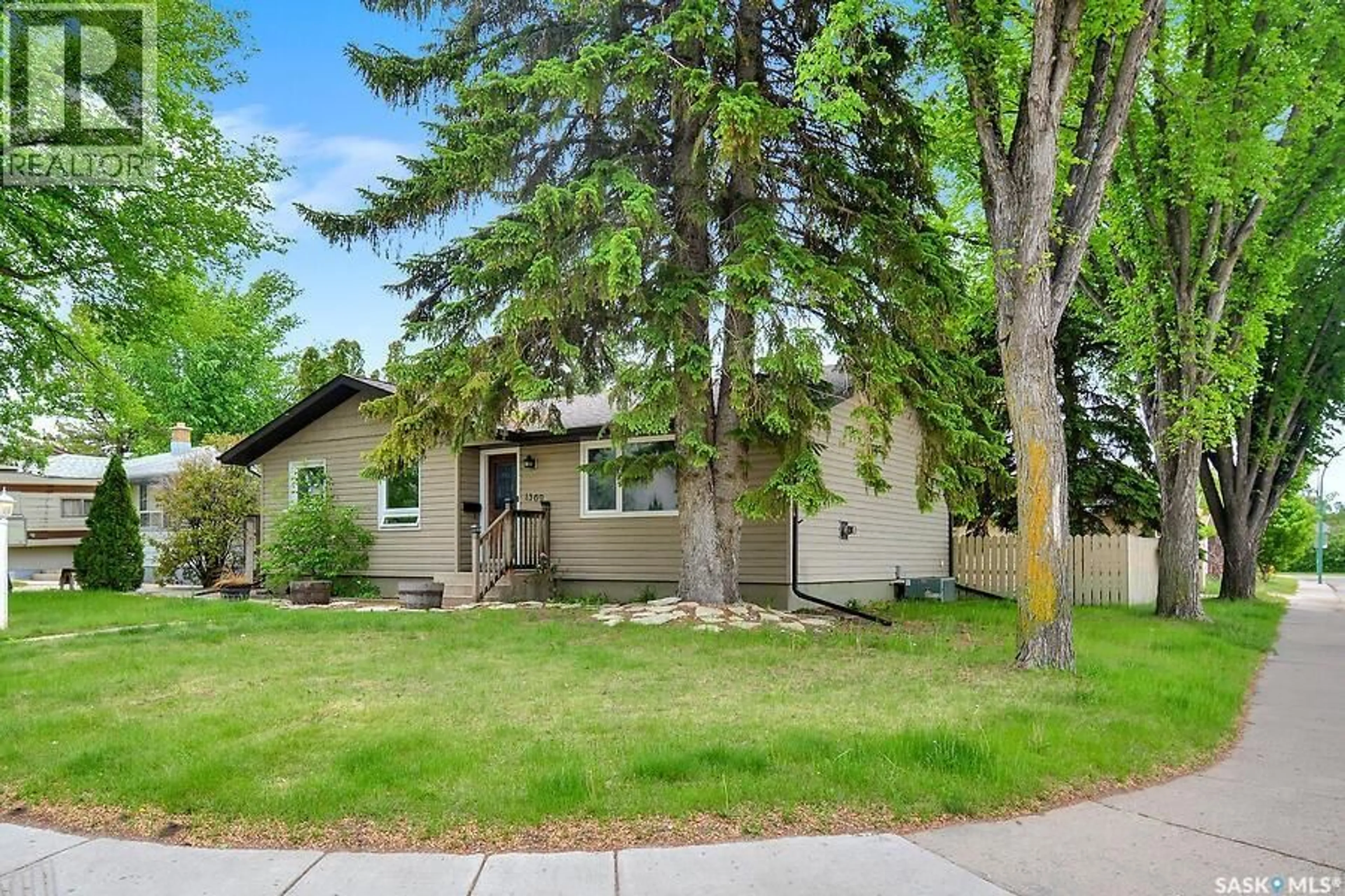 Home with vinyl exterior material, street for 1369 EAST CENTRE, Saskatoon Saskatchewan S7J3A8