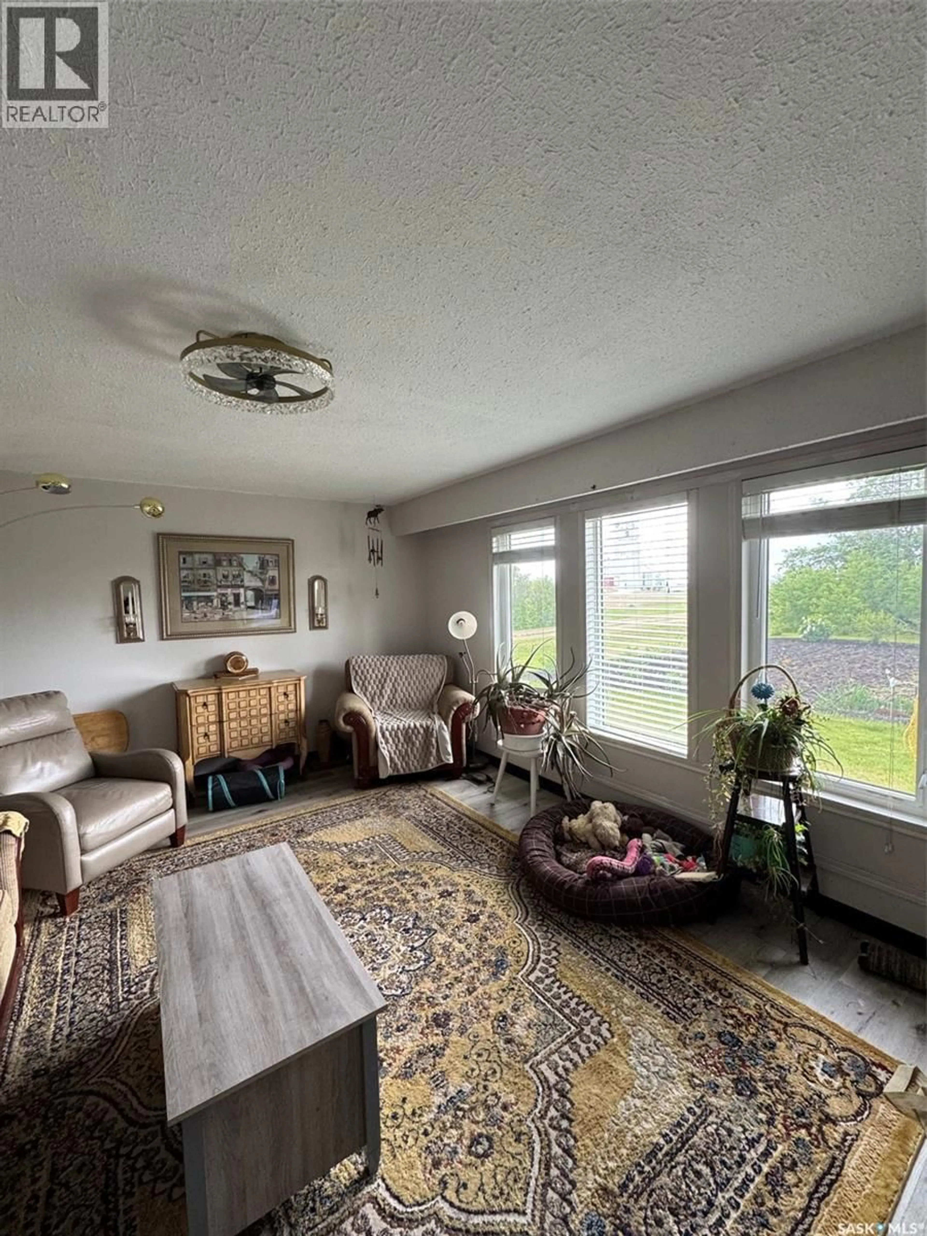 Living room with furniture, unknown for 207 RAILWAY AVENUE, Rabbit Lake Saskatchewan S0M2L0